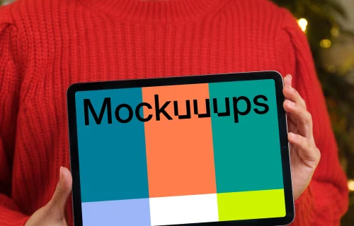 Woman in red sweater holding tablet mockup
