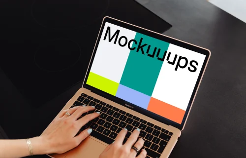 Woman typing a MacBook Air mockup