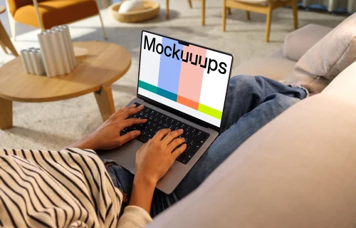 Woman typing on a MacBook Pro 14 mockup