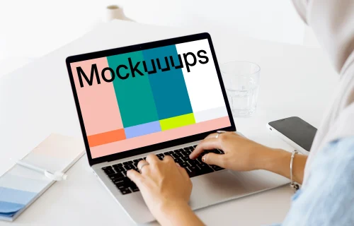 Woman typing on a MacBook Pro mockup