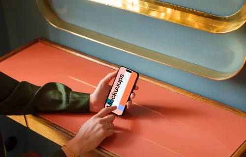 Woman typing on a phone in the lounge