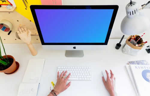 Woman working on iMac mockup