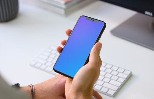 Young man holding iPhone 11 mockup