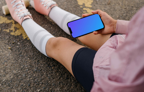 Young woman holding a smartphone mockup