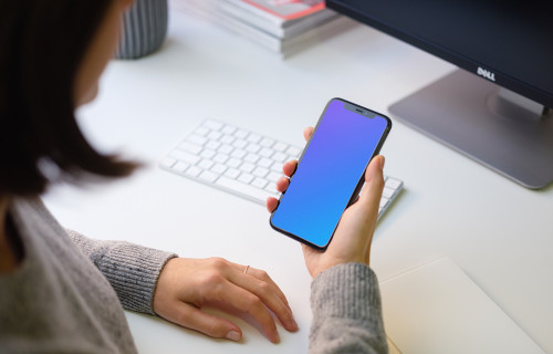 Young woman holding iPhone 11 mockup