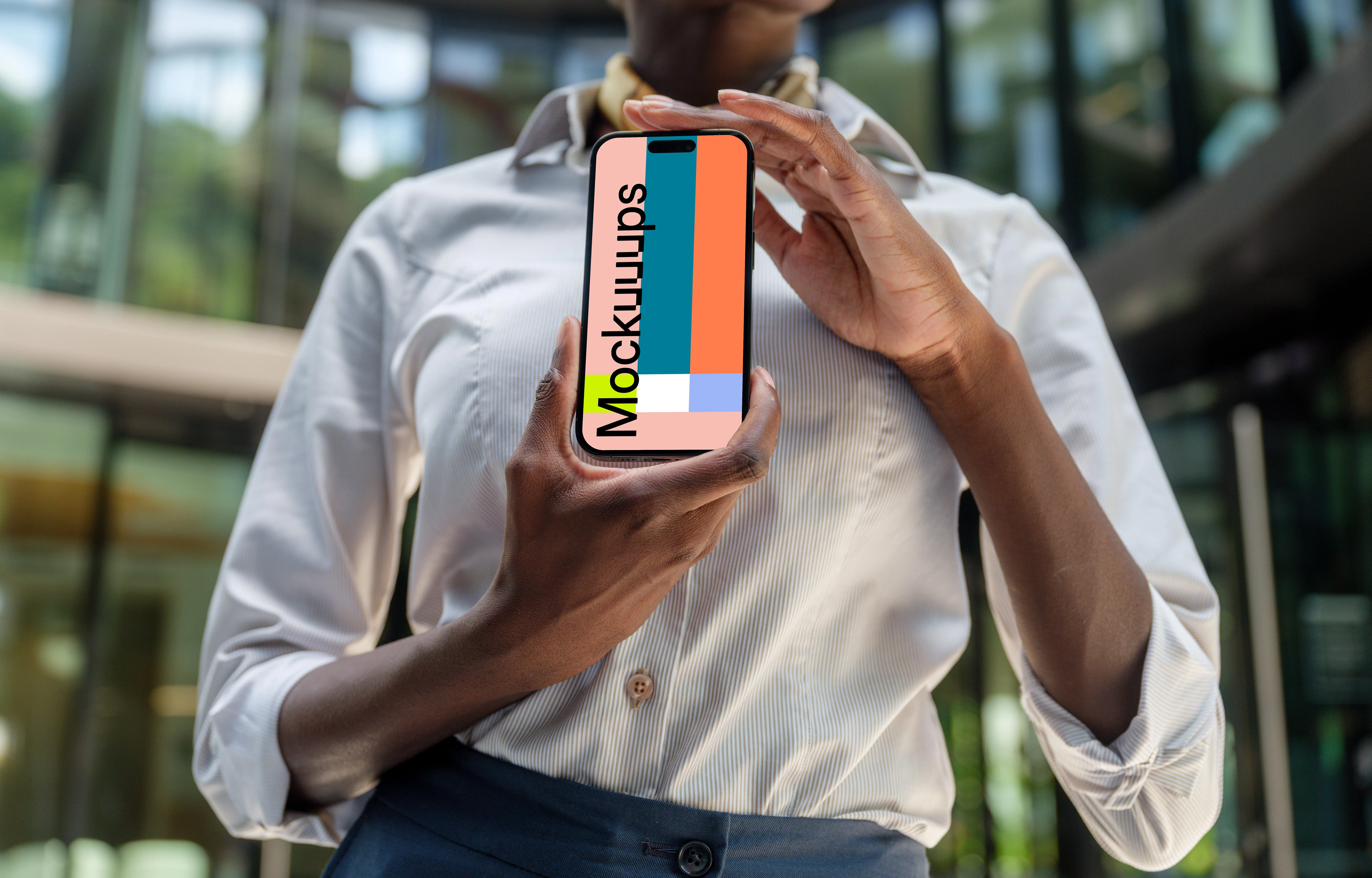 Female entrepreneur holding an iPhone 14 Pro mockup