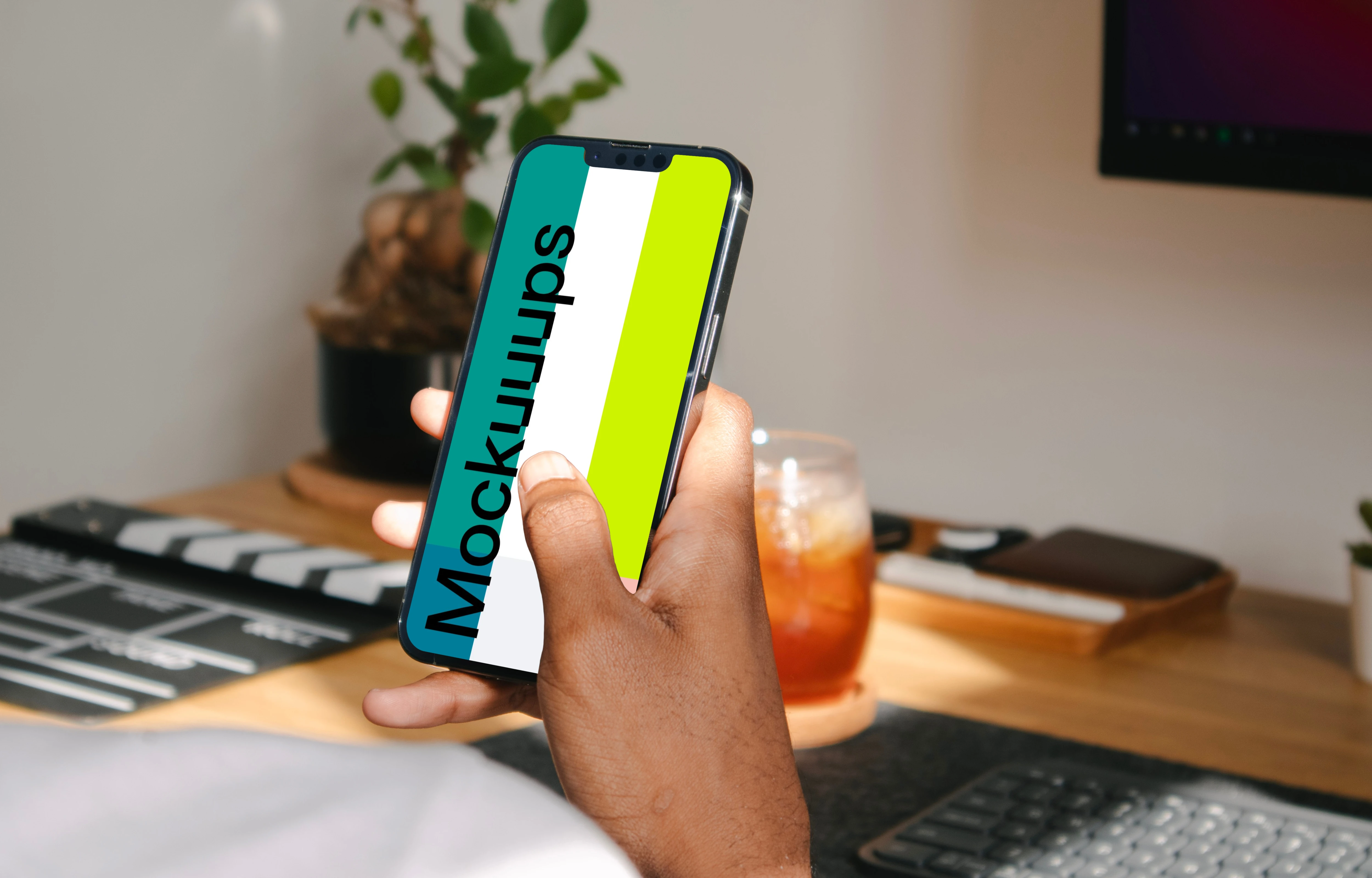 Hand holding a smartphone mockup
