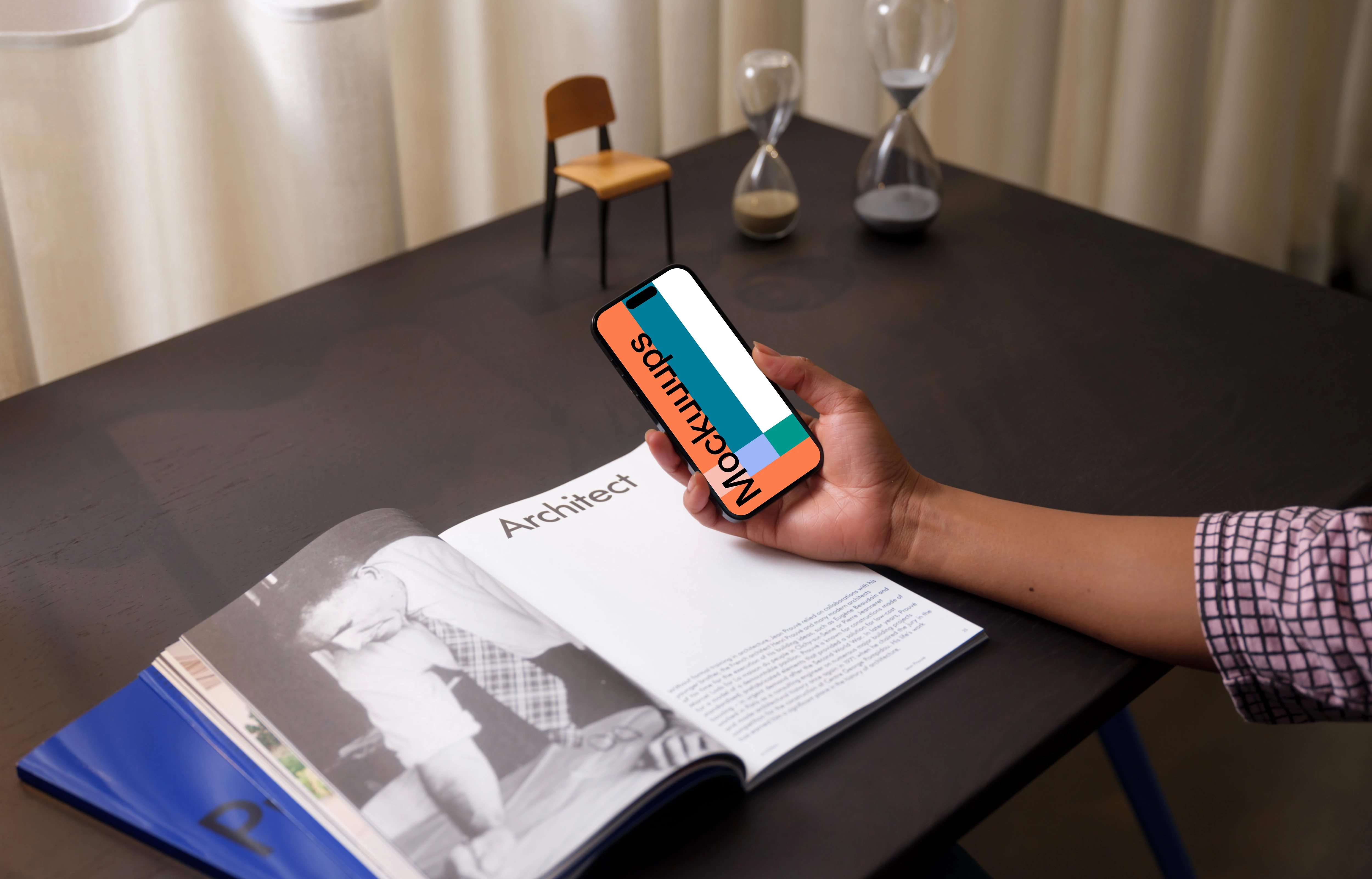 Hand holding an iPhone 14 Pro mockup