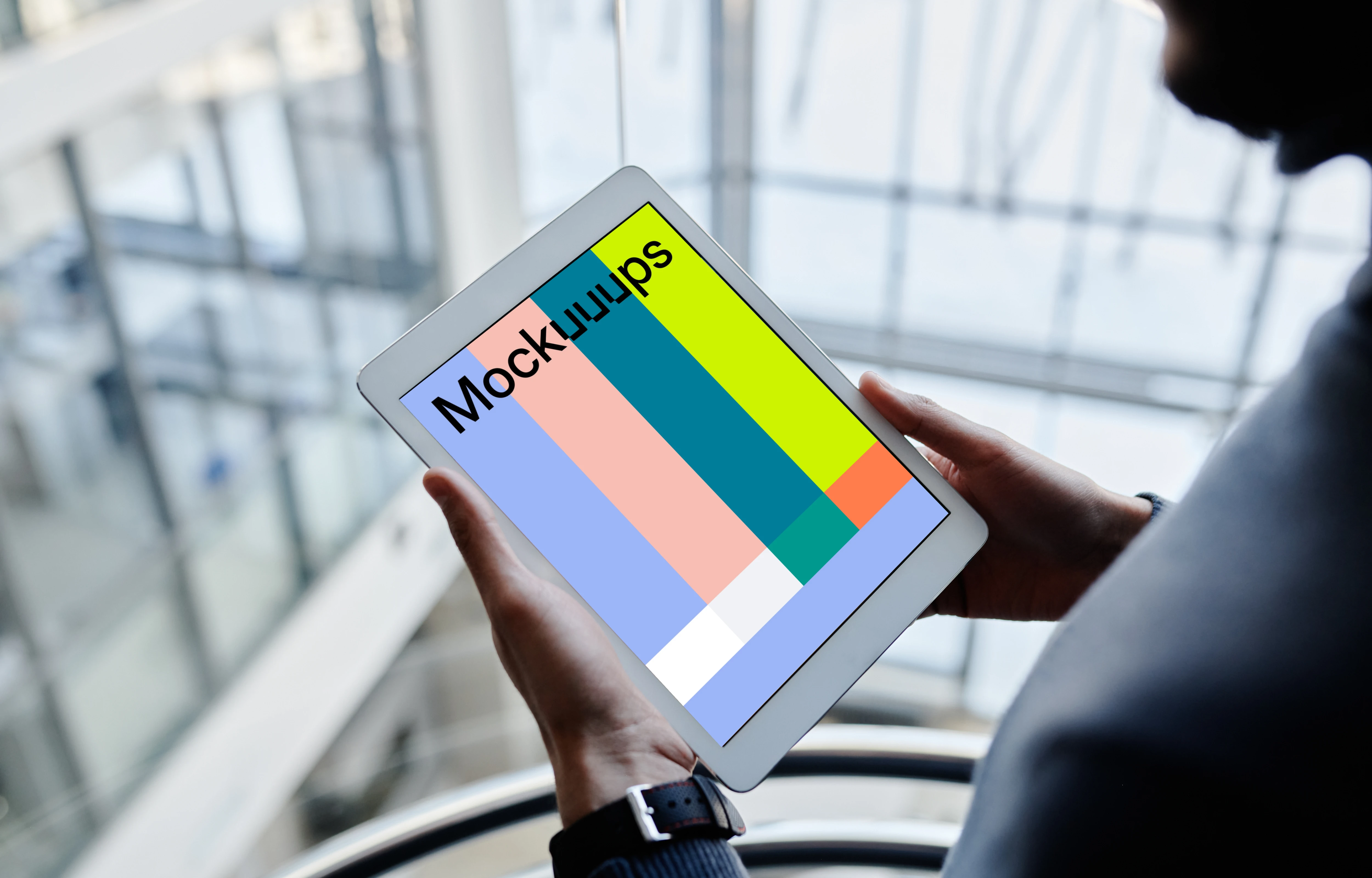 iPad Mini mockup held by male user