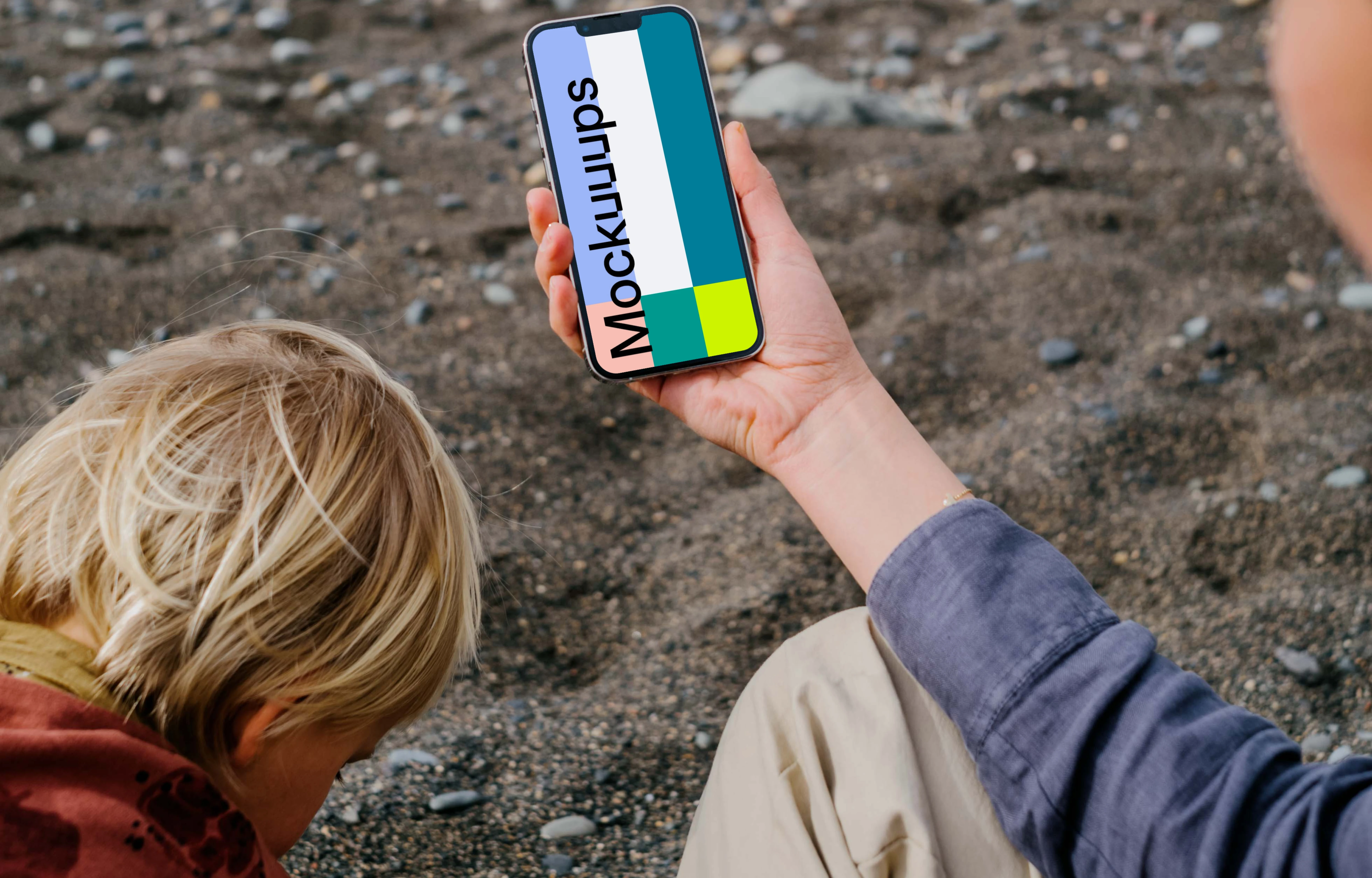 iPhone 13 Pro mockup held by a user at the beach