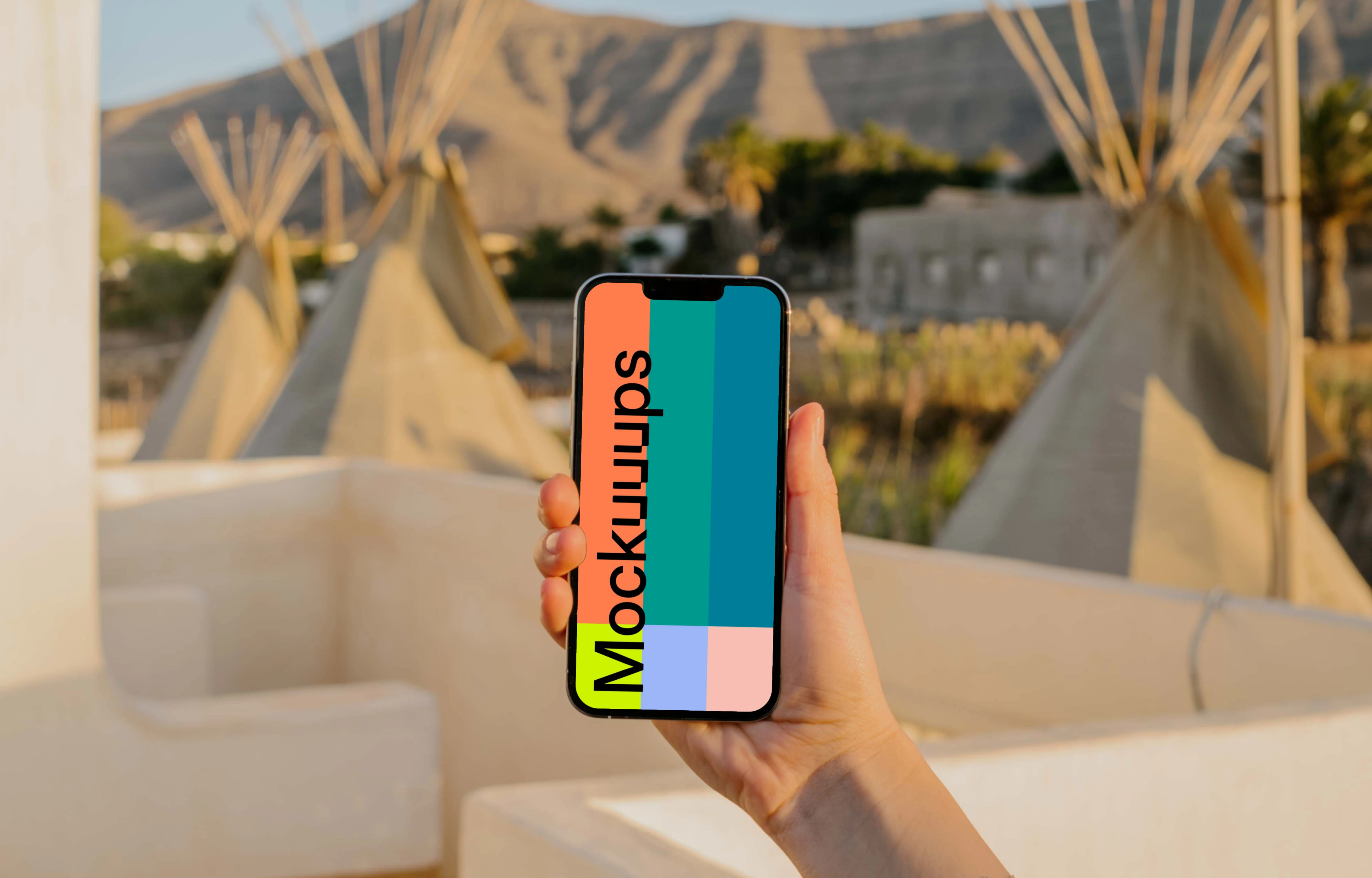 iPhone 13 Pro mockup held by a user outdoors in the sun