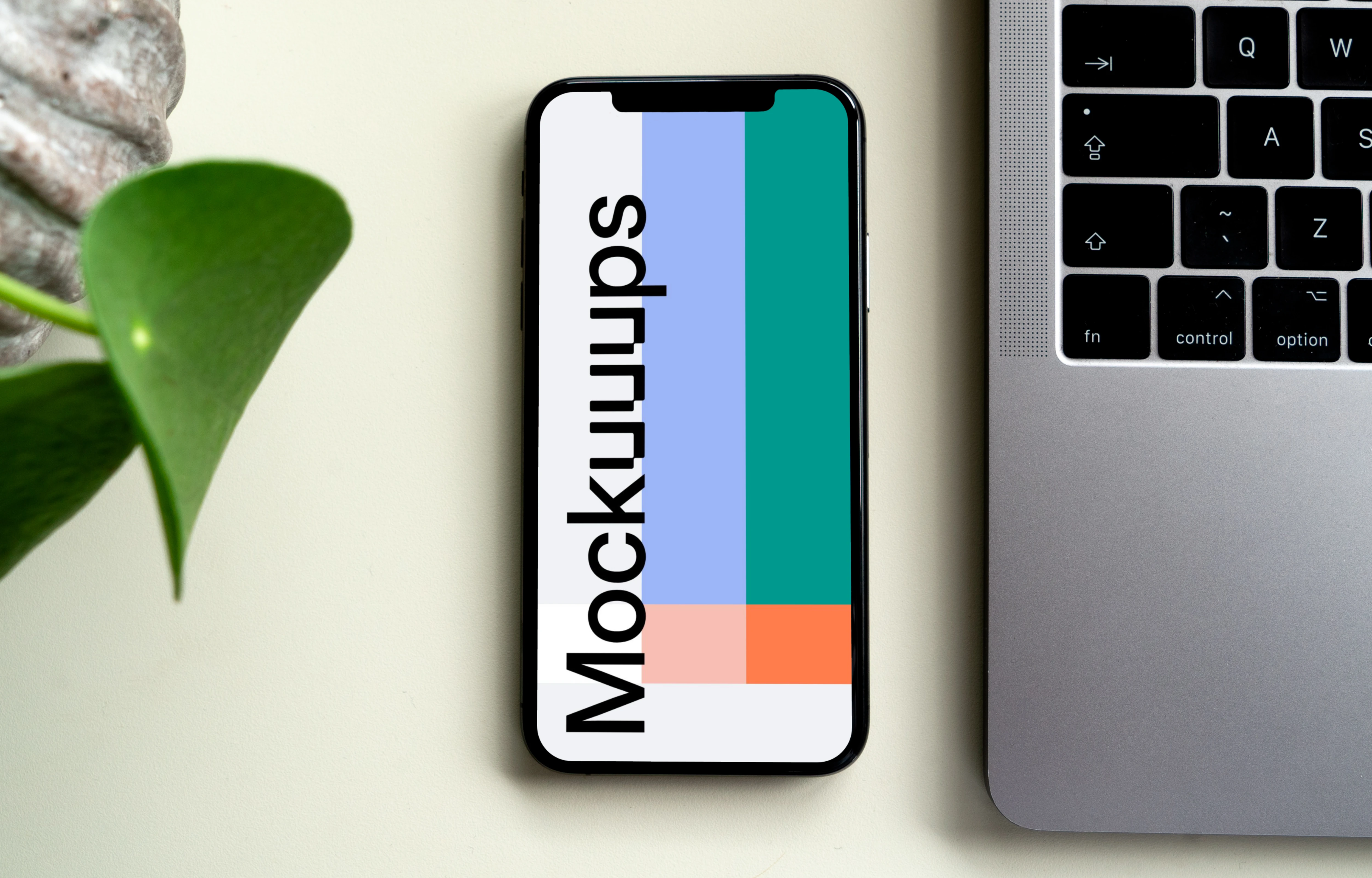 iPhone mockup beside a MacBook