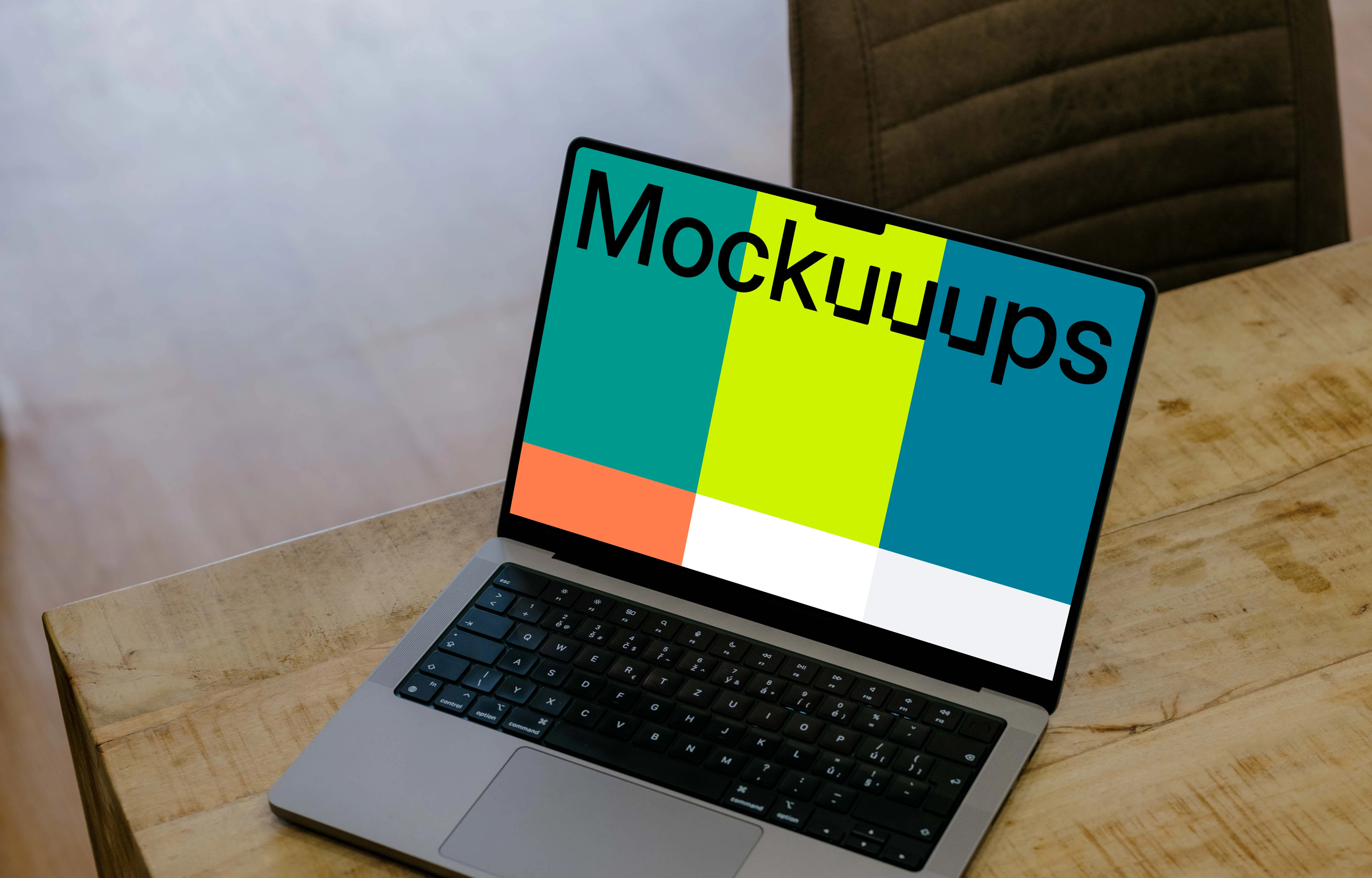 Laptop mockup on the wooden table