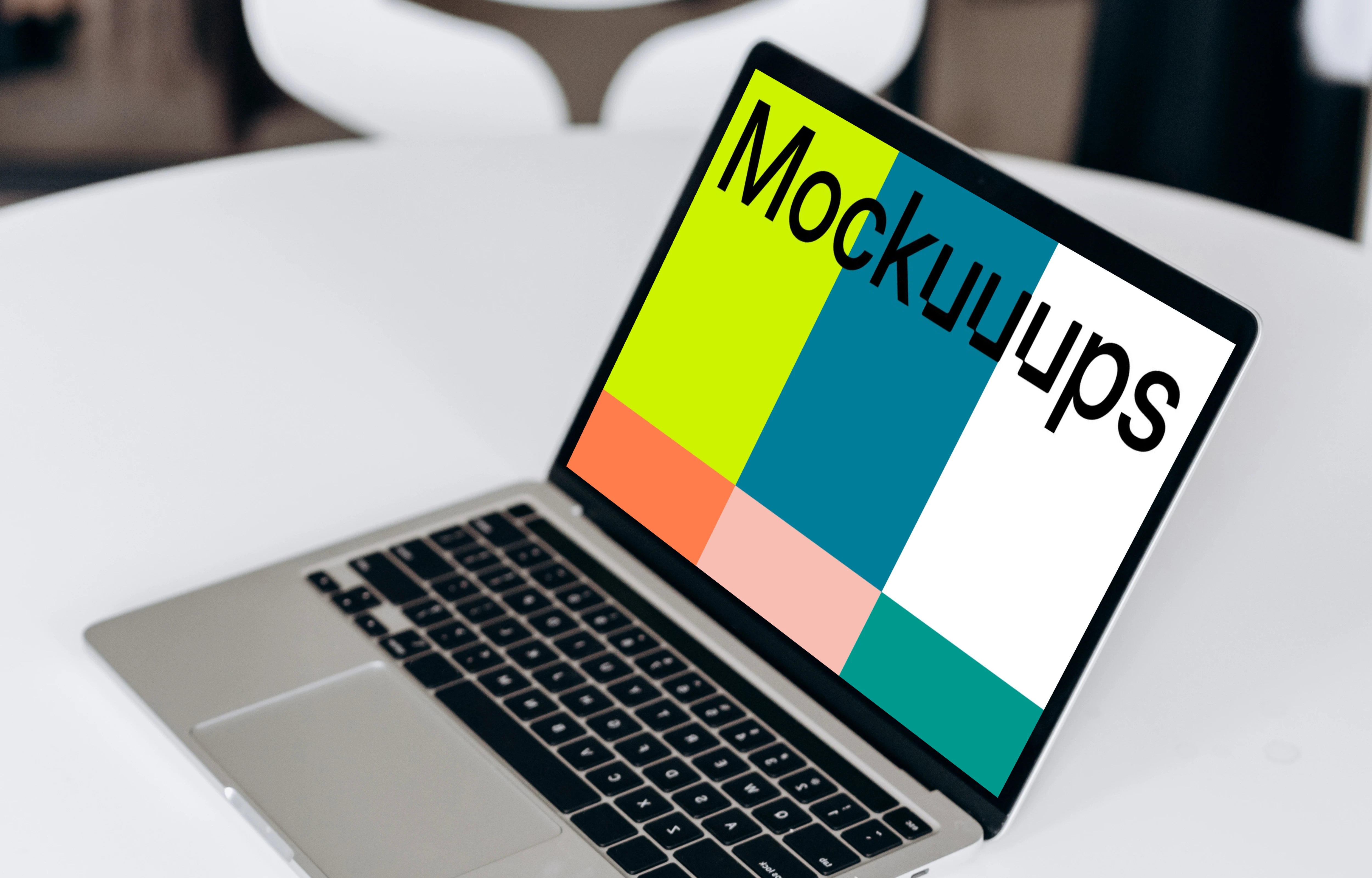 MacBook Pro mockup beside a phone and notepad
