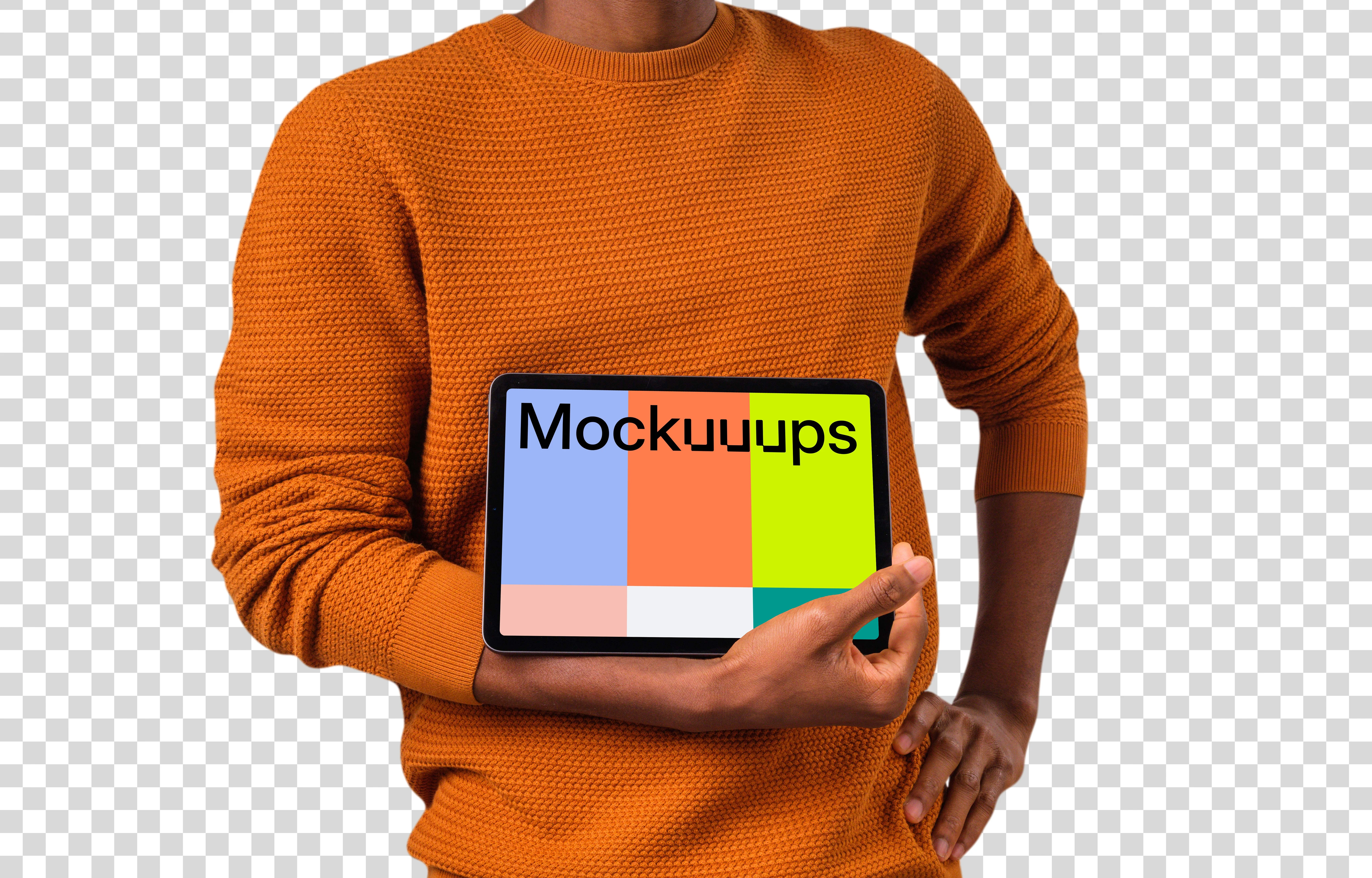 Man in orange sweather holding iPad mockup in landscape