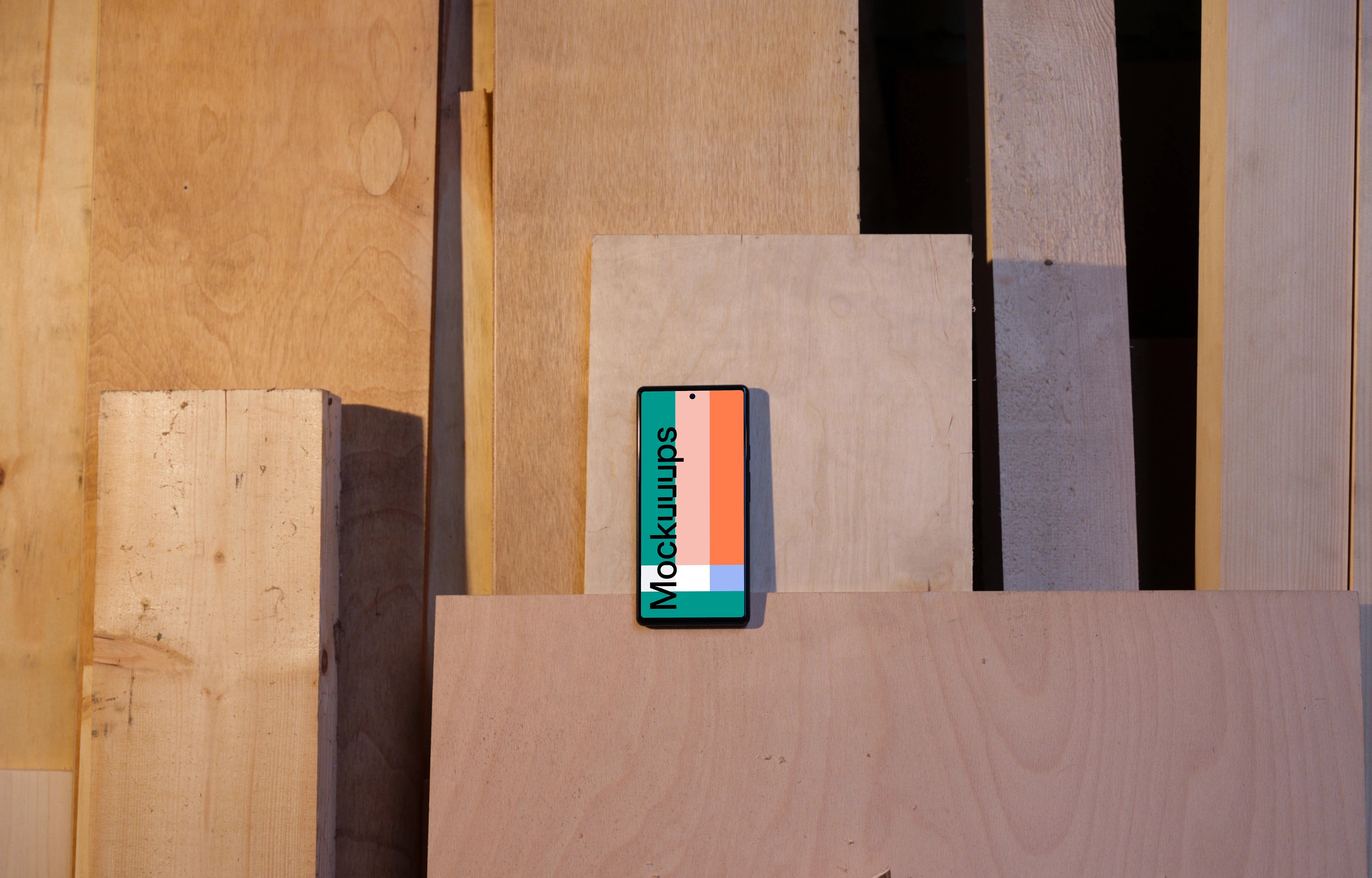 Mockup of Google Pixel 6 placed on wooden boards