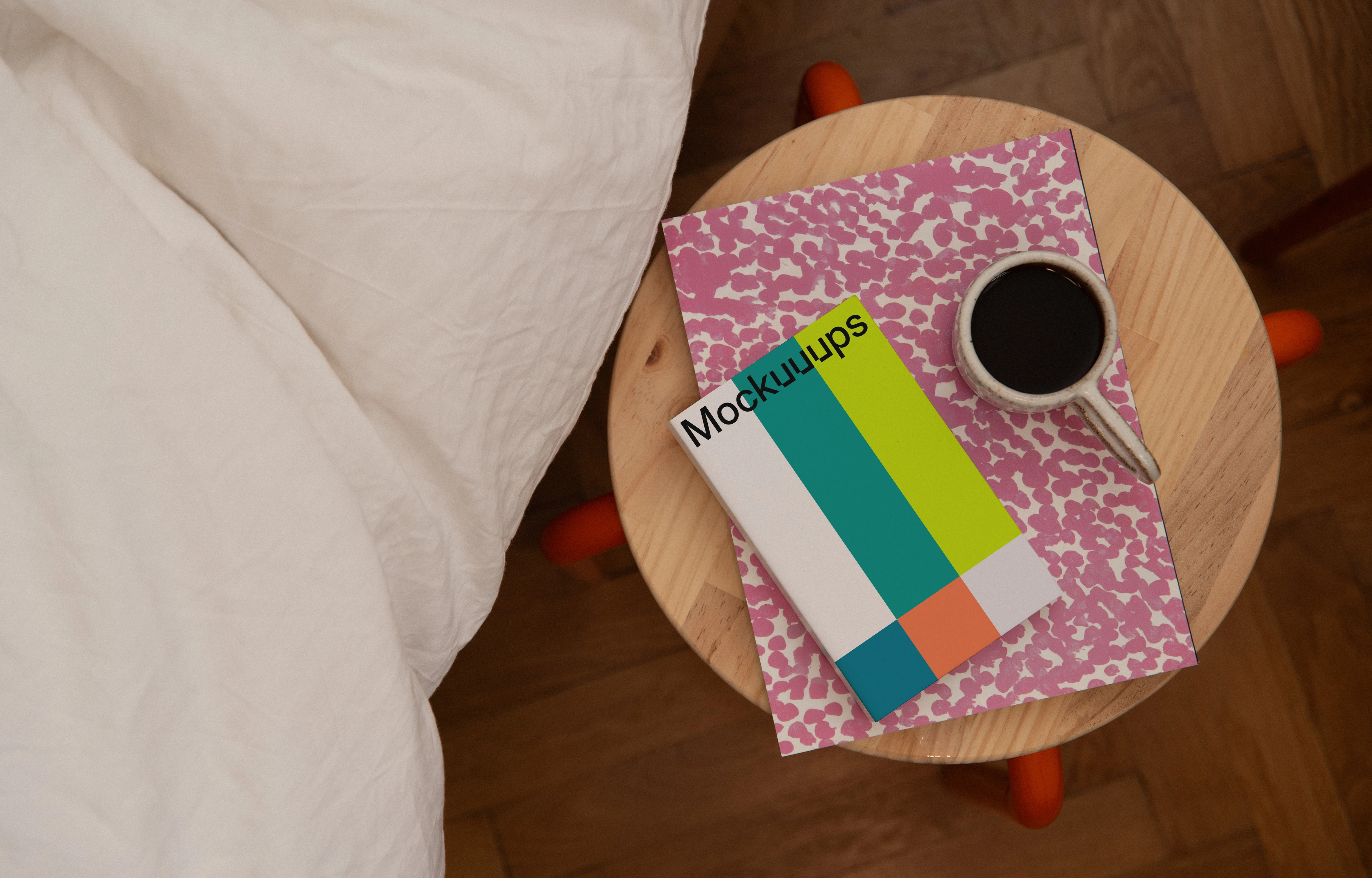 Softcover book mockup on a wooden bedside table