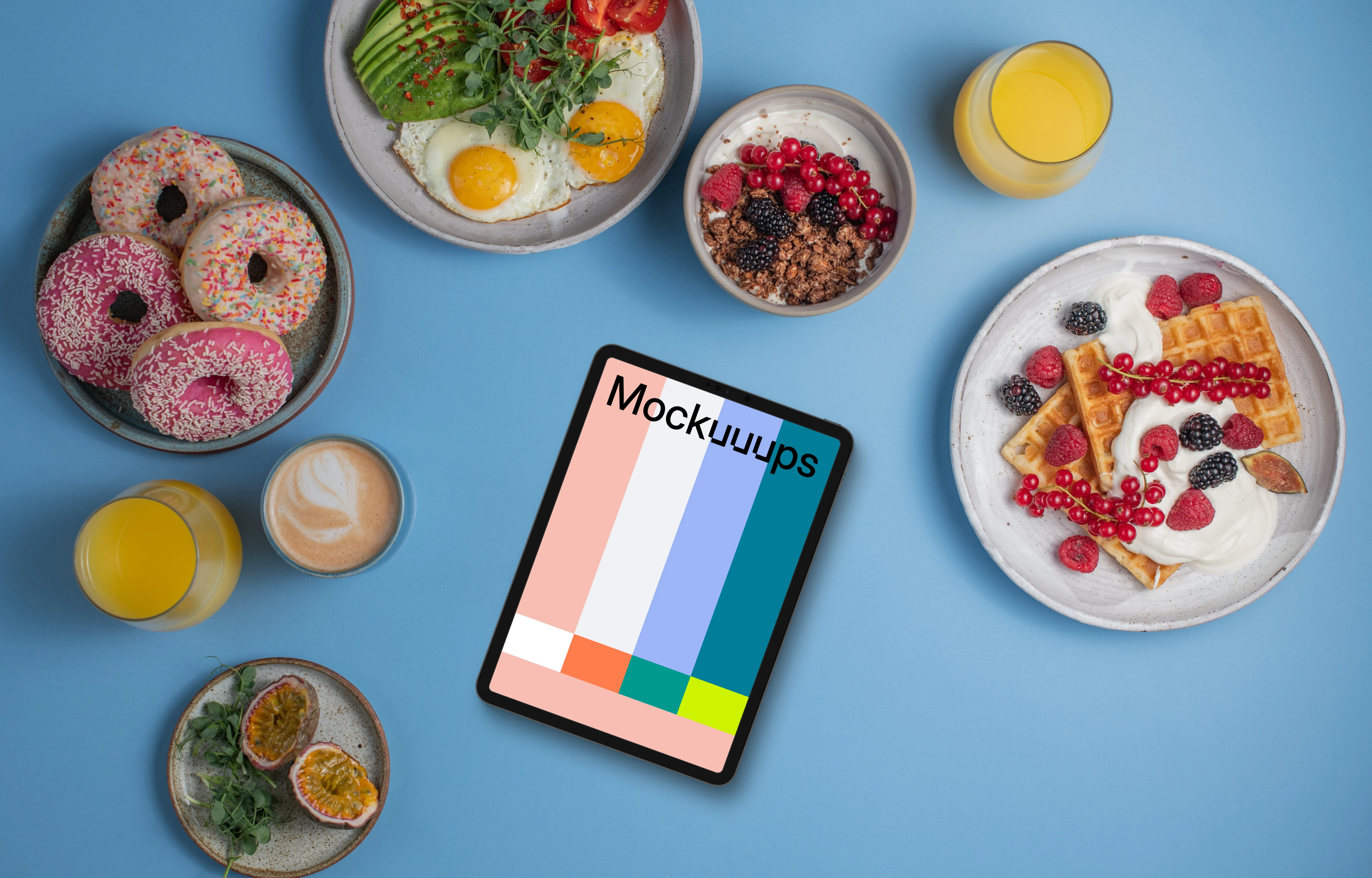 Tablet mockup around delicious breakfast meals