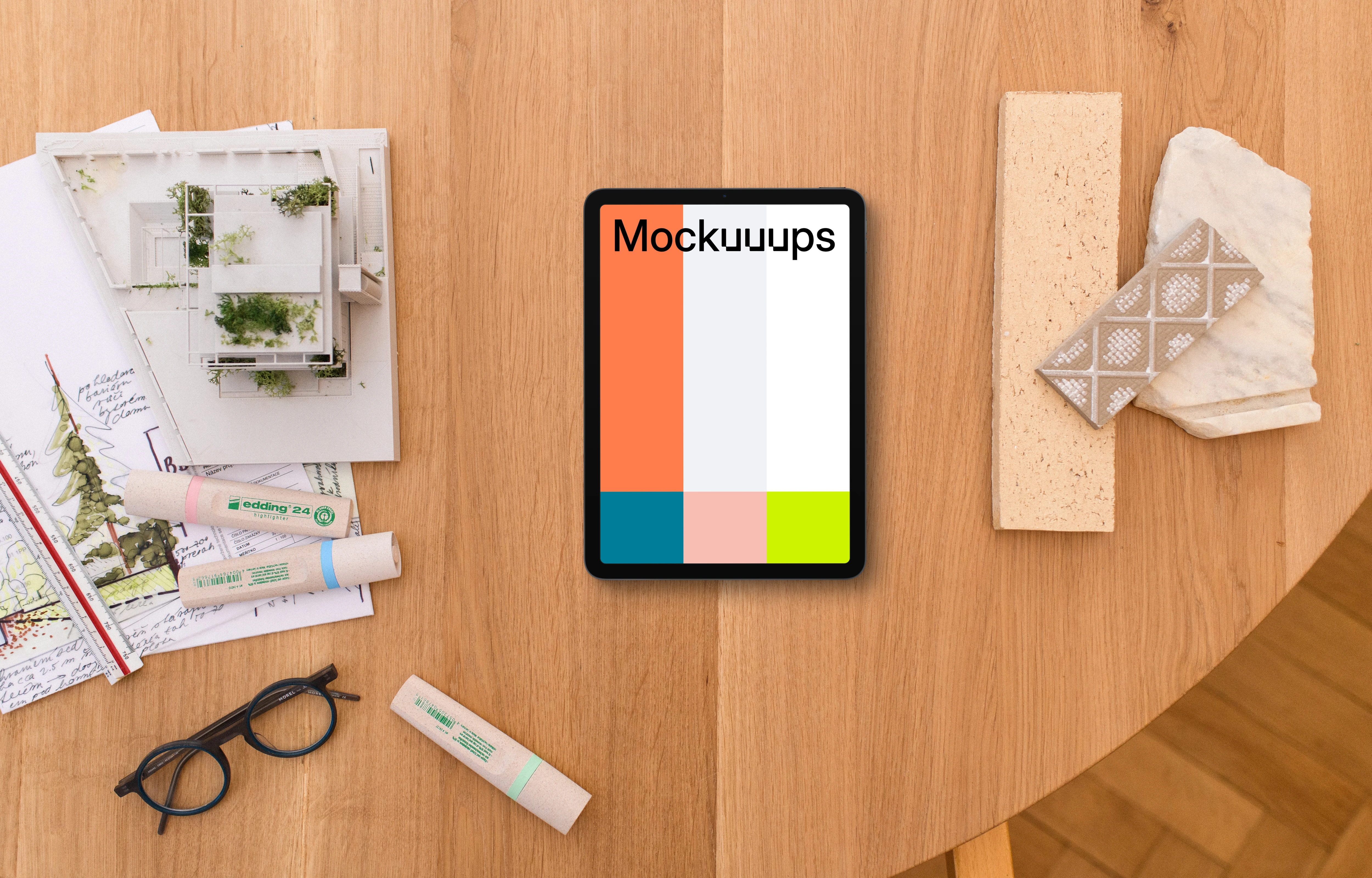 Tablet mockup on an architect's workspace