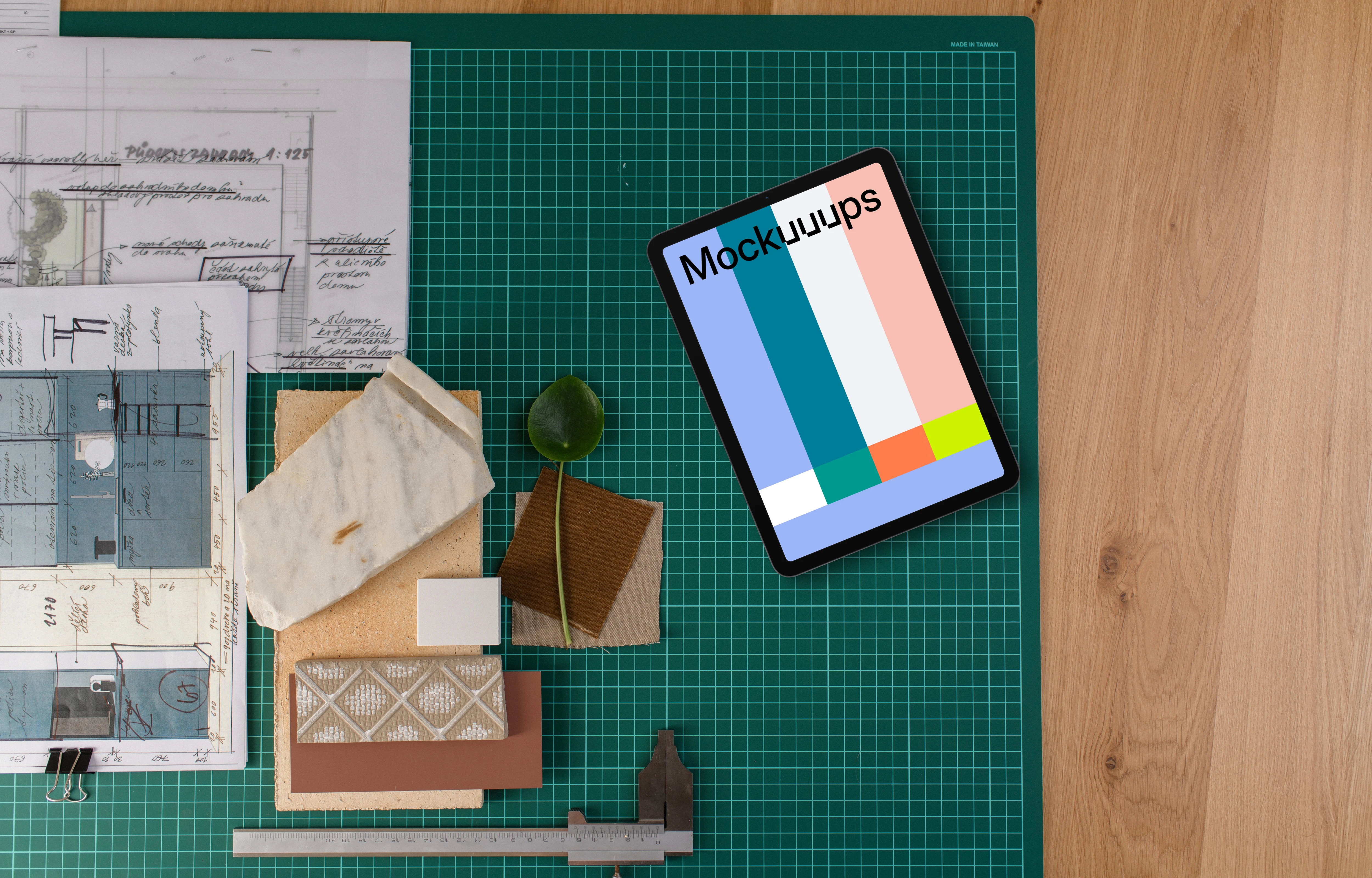Tablet mockup on architect's planning table