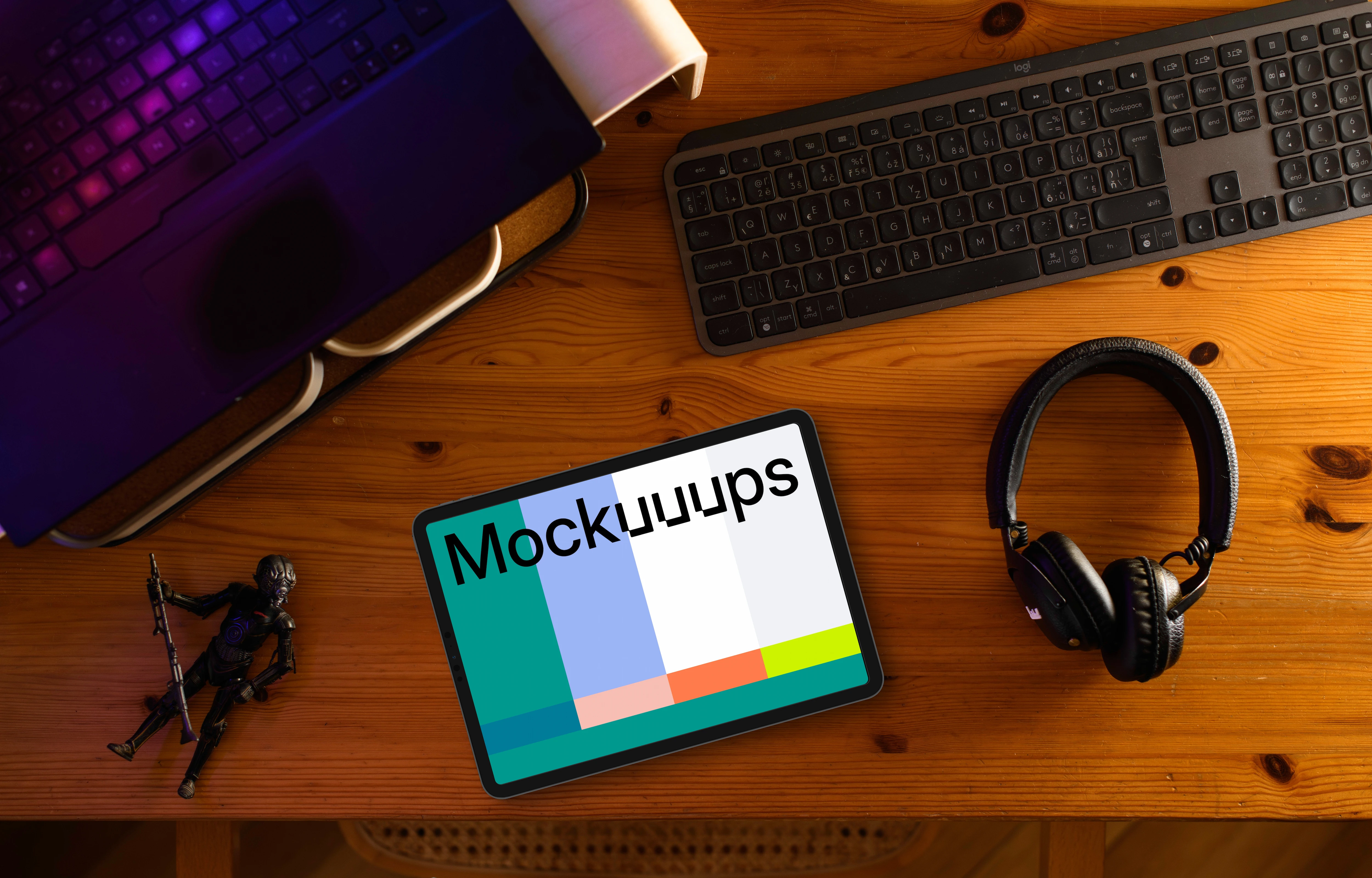 Tablet mockup on wooden desk with creative gadgets