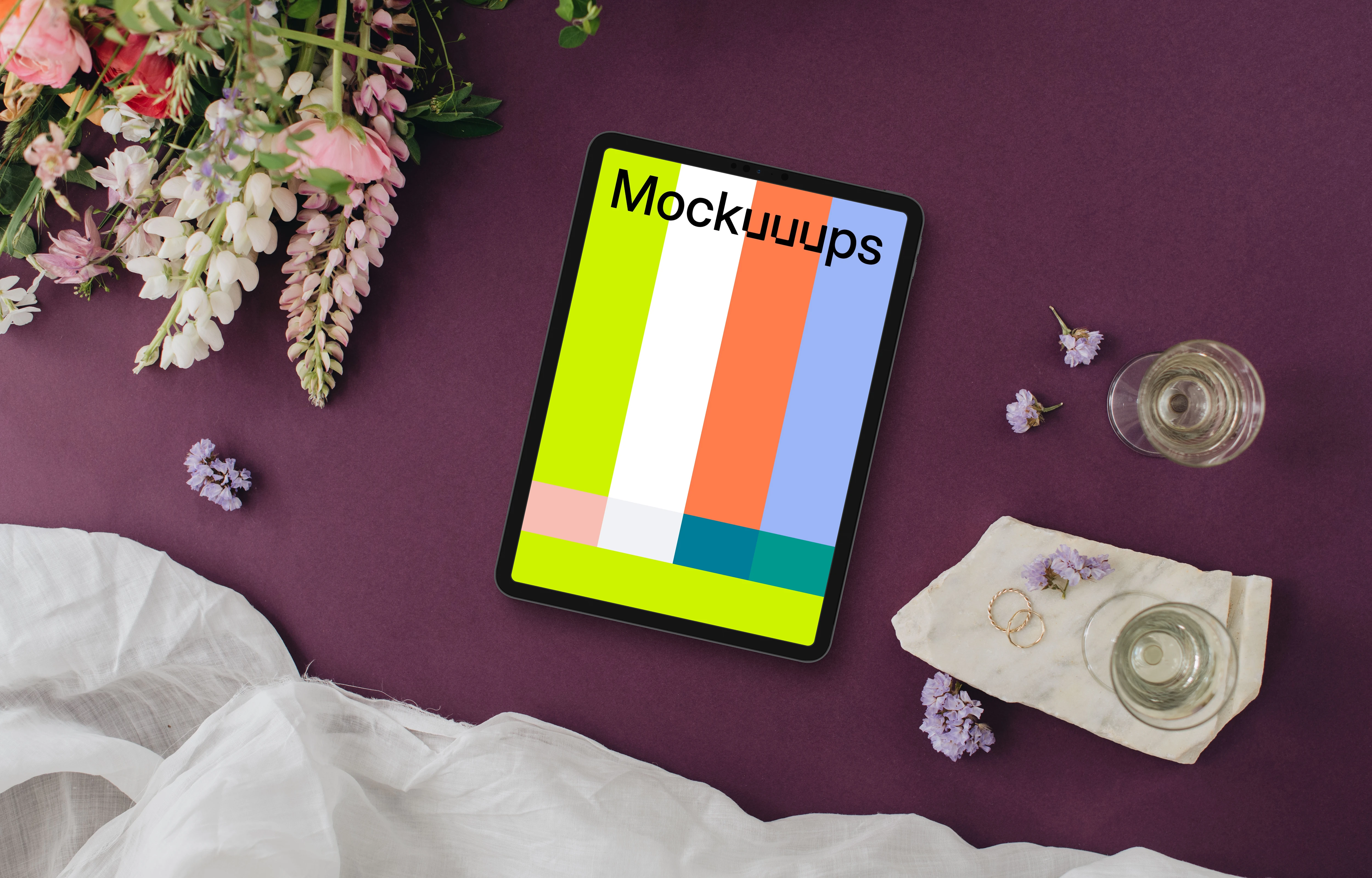 Wedding bliss with iPad mockup, rings, and flowers