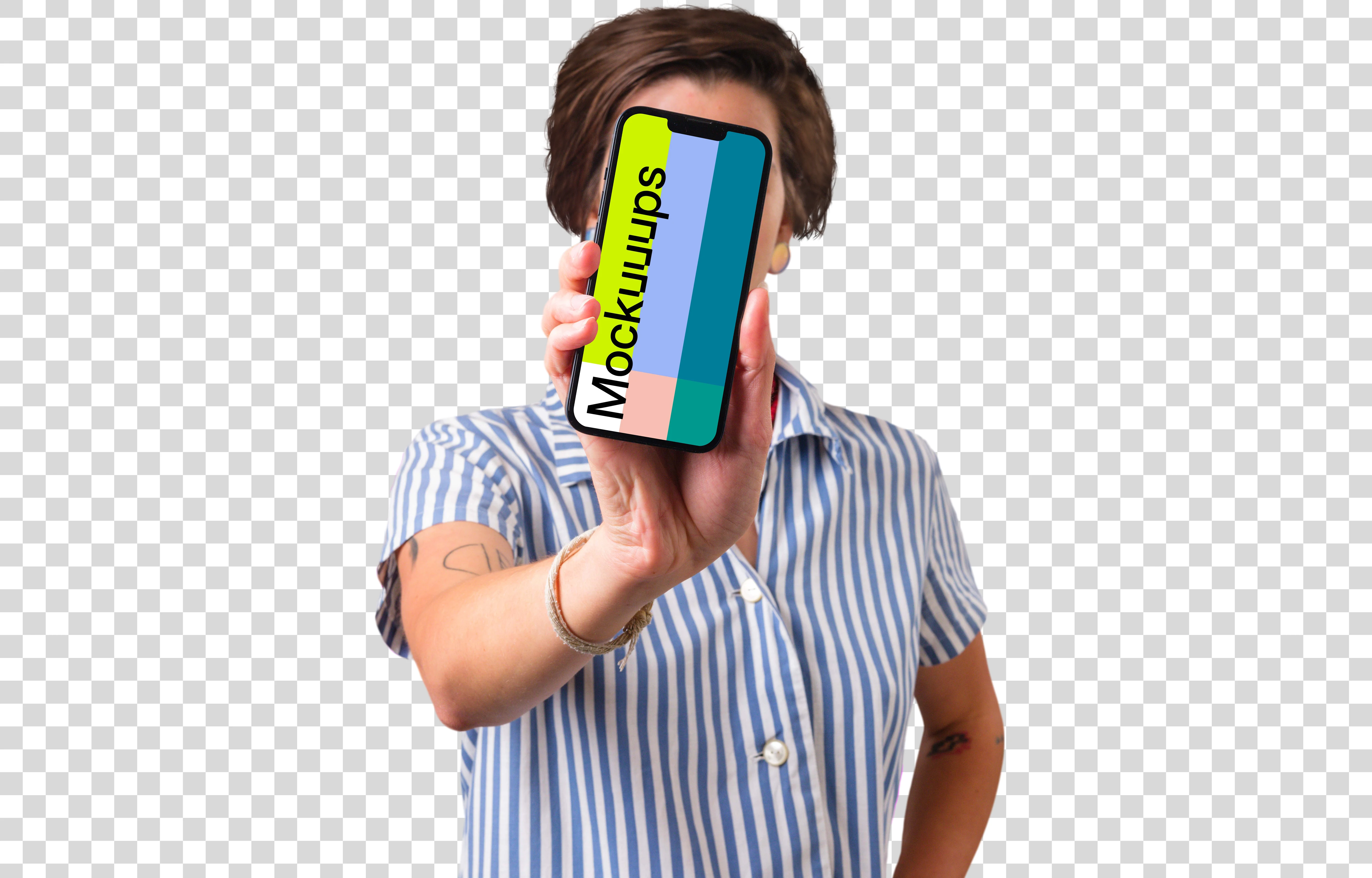 Woman holding iPhone mockup in front of her face