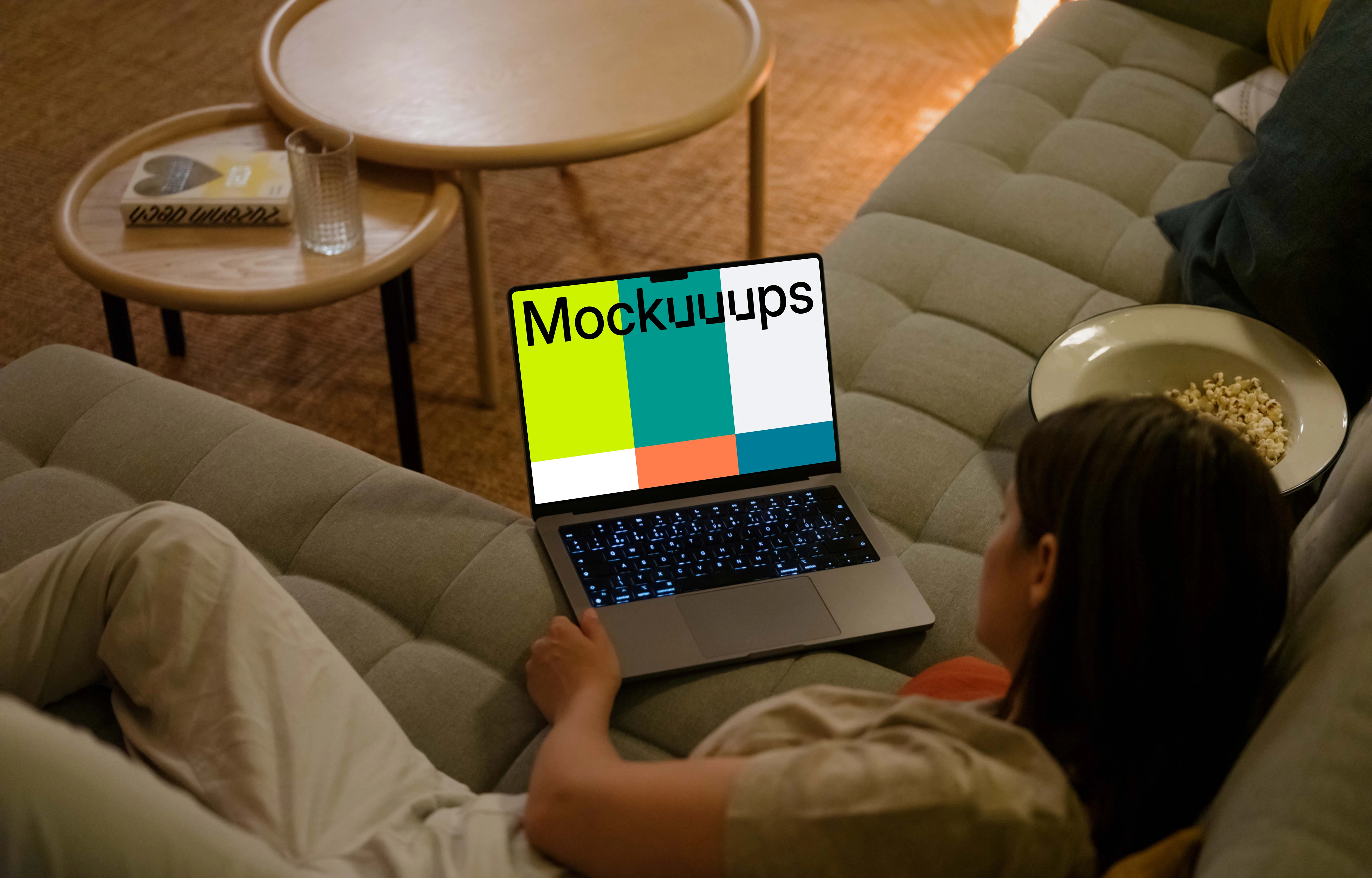 Woman looking at MacBook Pro mockup