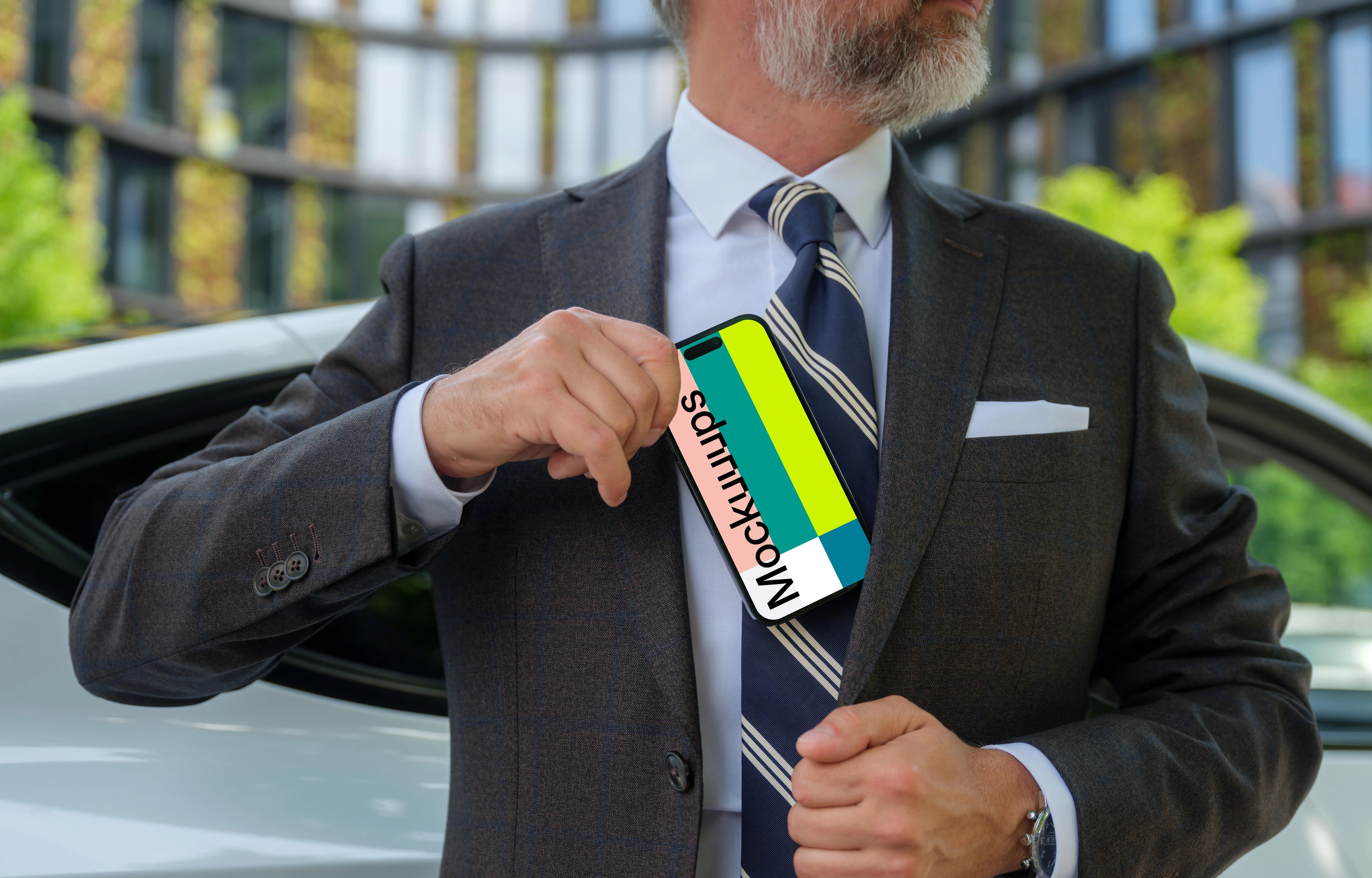 Businessman putting iPhone in his pocket