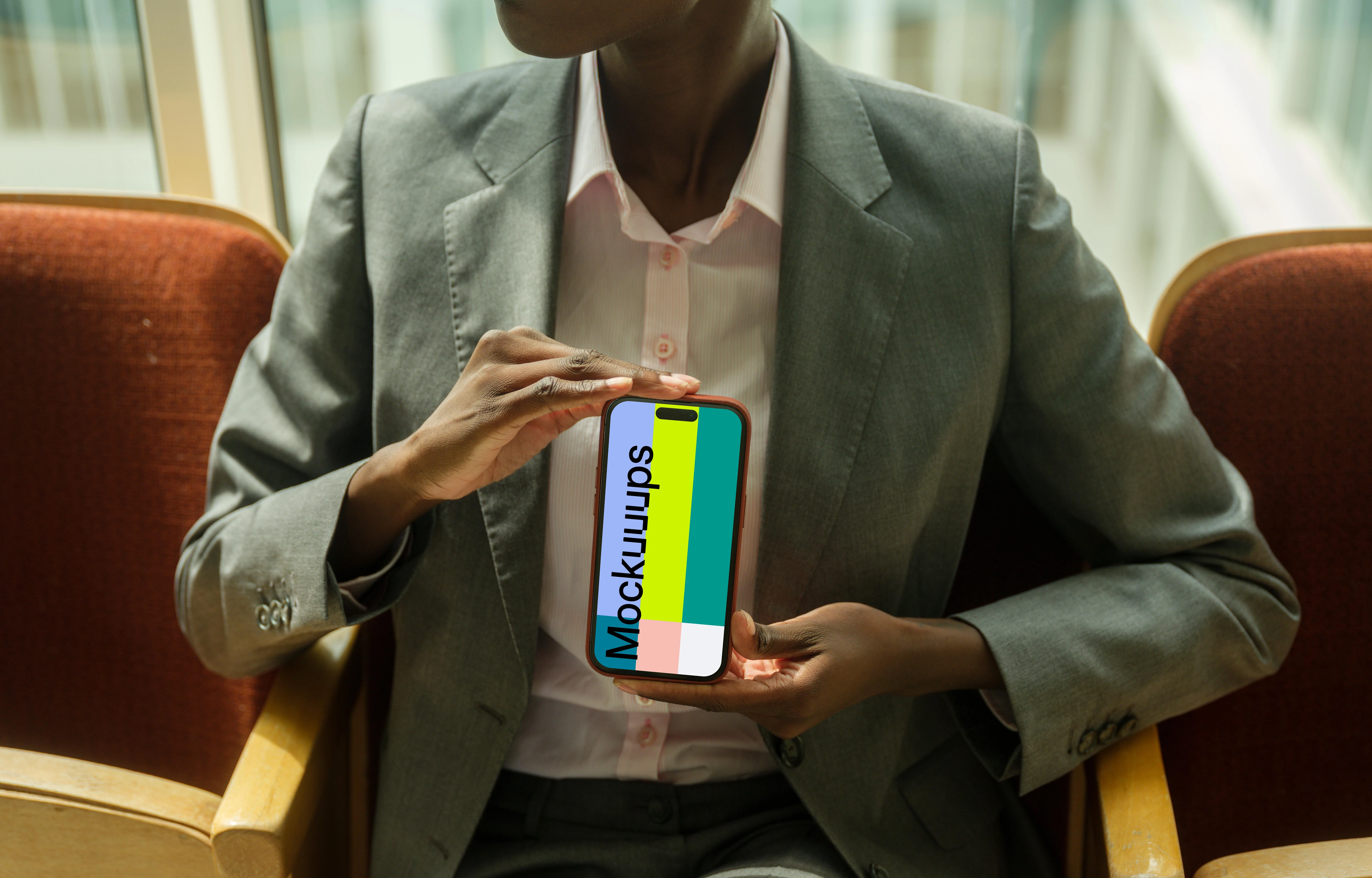 Businesswoman holding an iPhone mockup