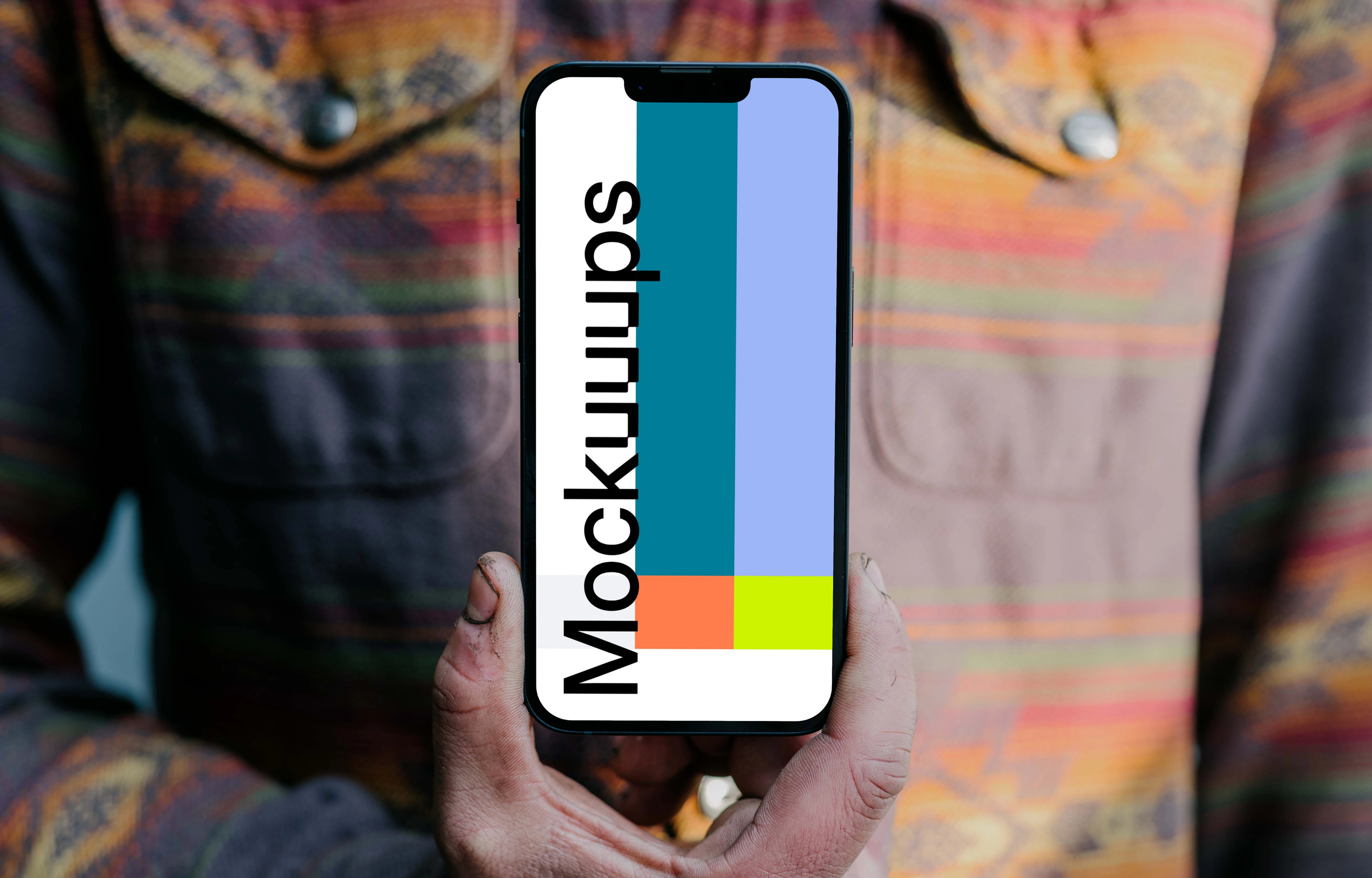 Man holding an iPhone 13 Pro mockup to his chest