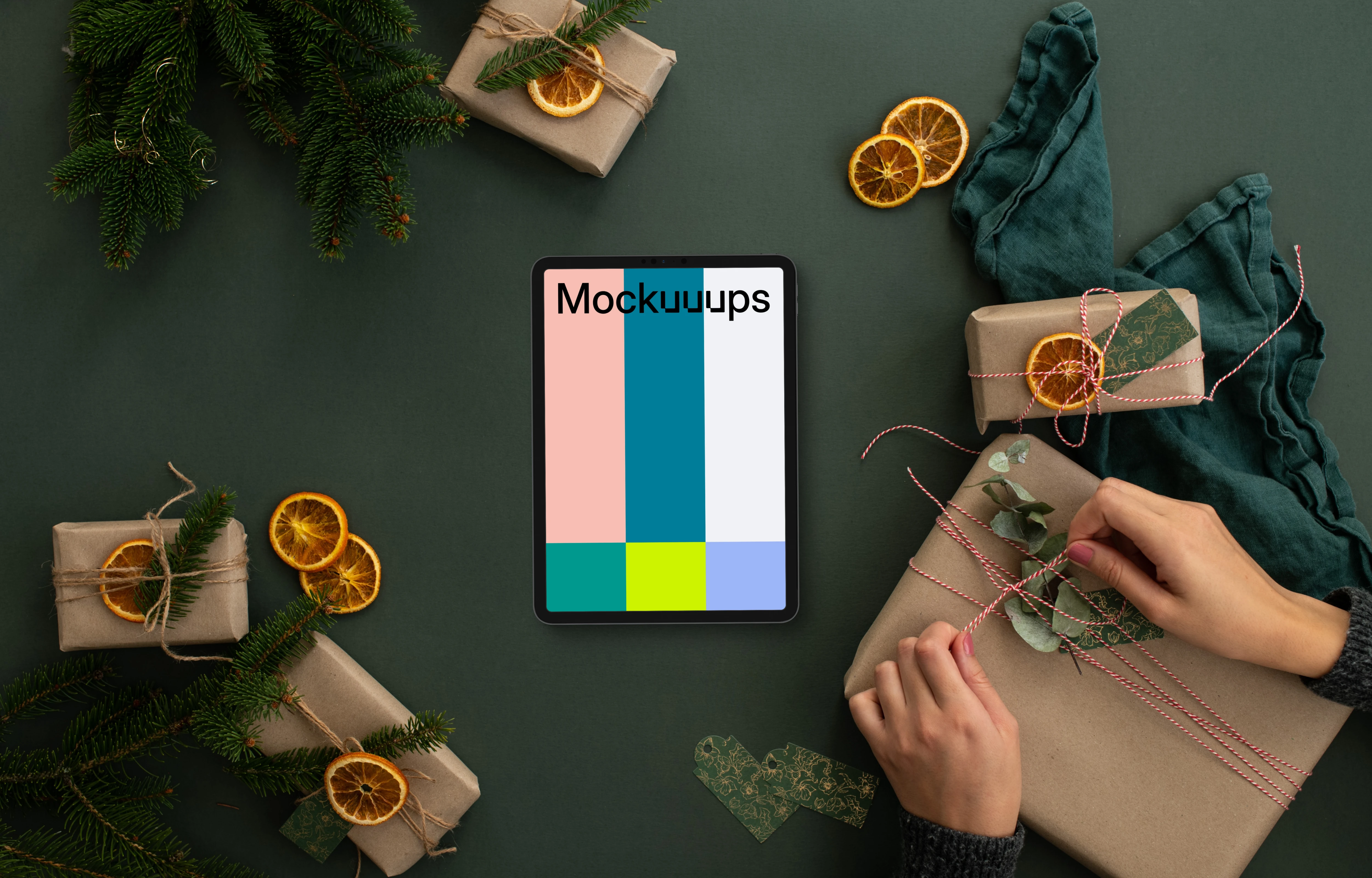 Christmas design mockup with a tablet and hands