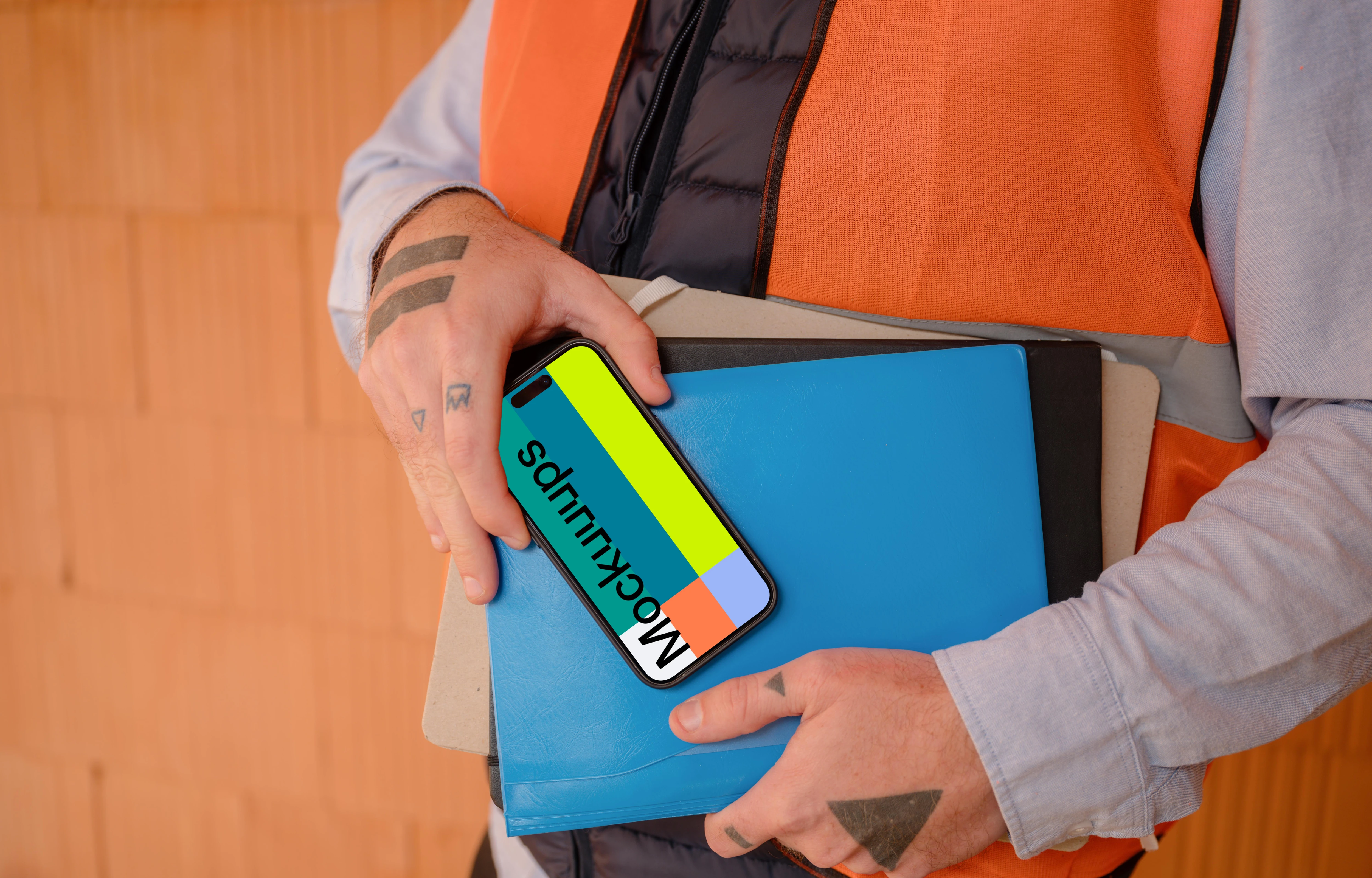 Construction worker presenting an iPhone 15 Pro mockup