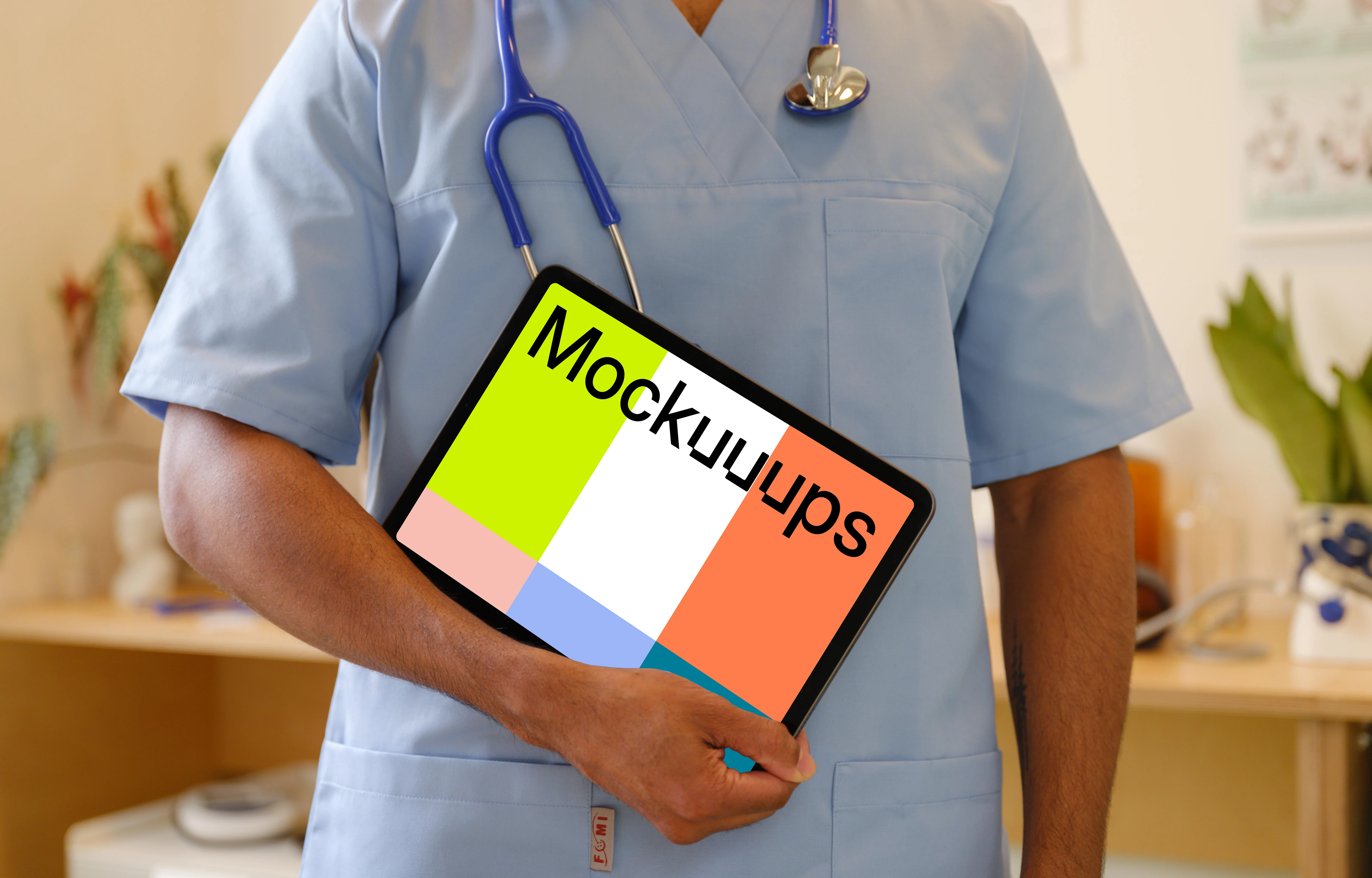 Doctor’s hand holding an iPad mockup