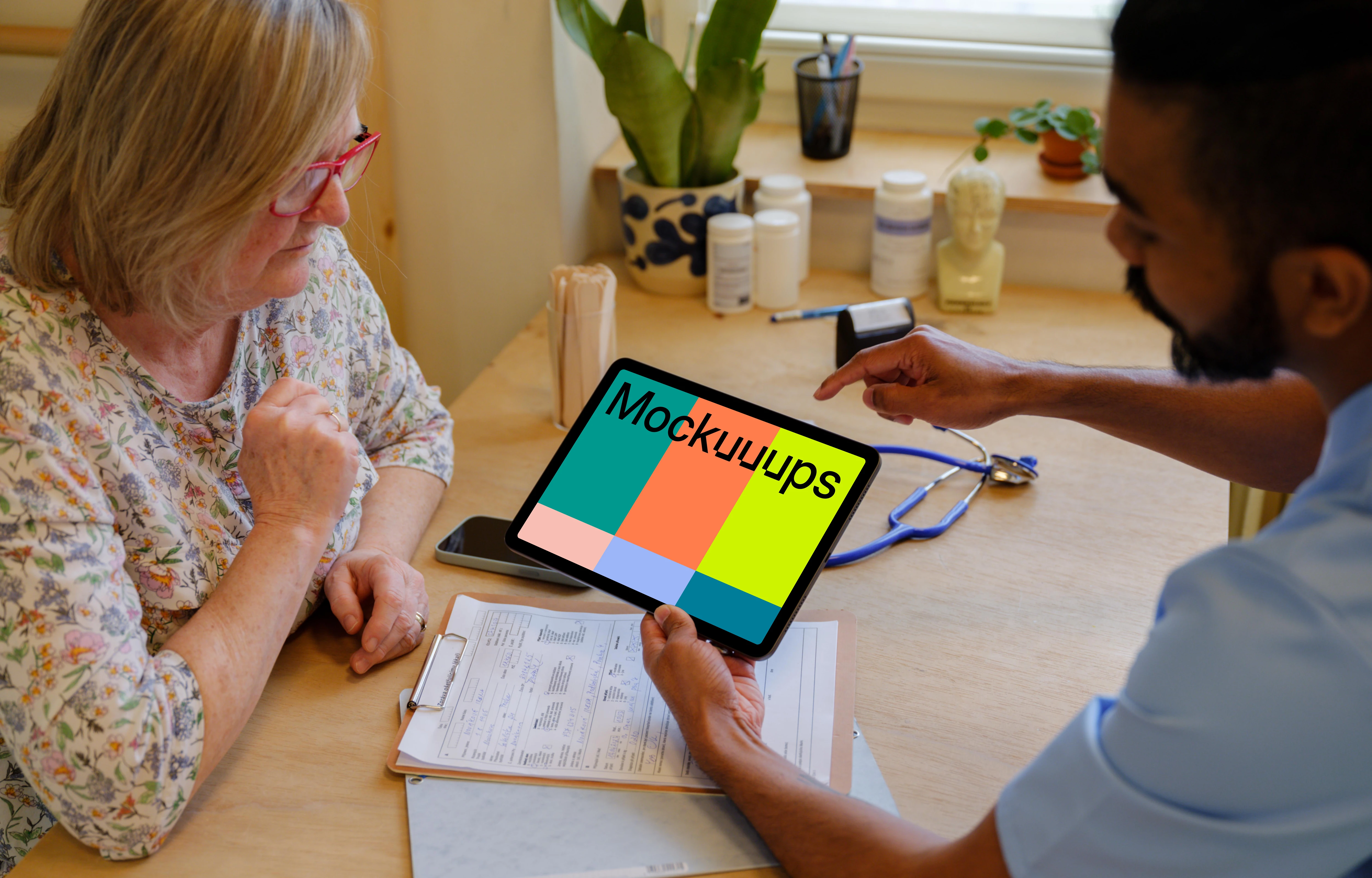 Doctor’s hand holding an iPad mockup