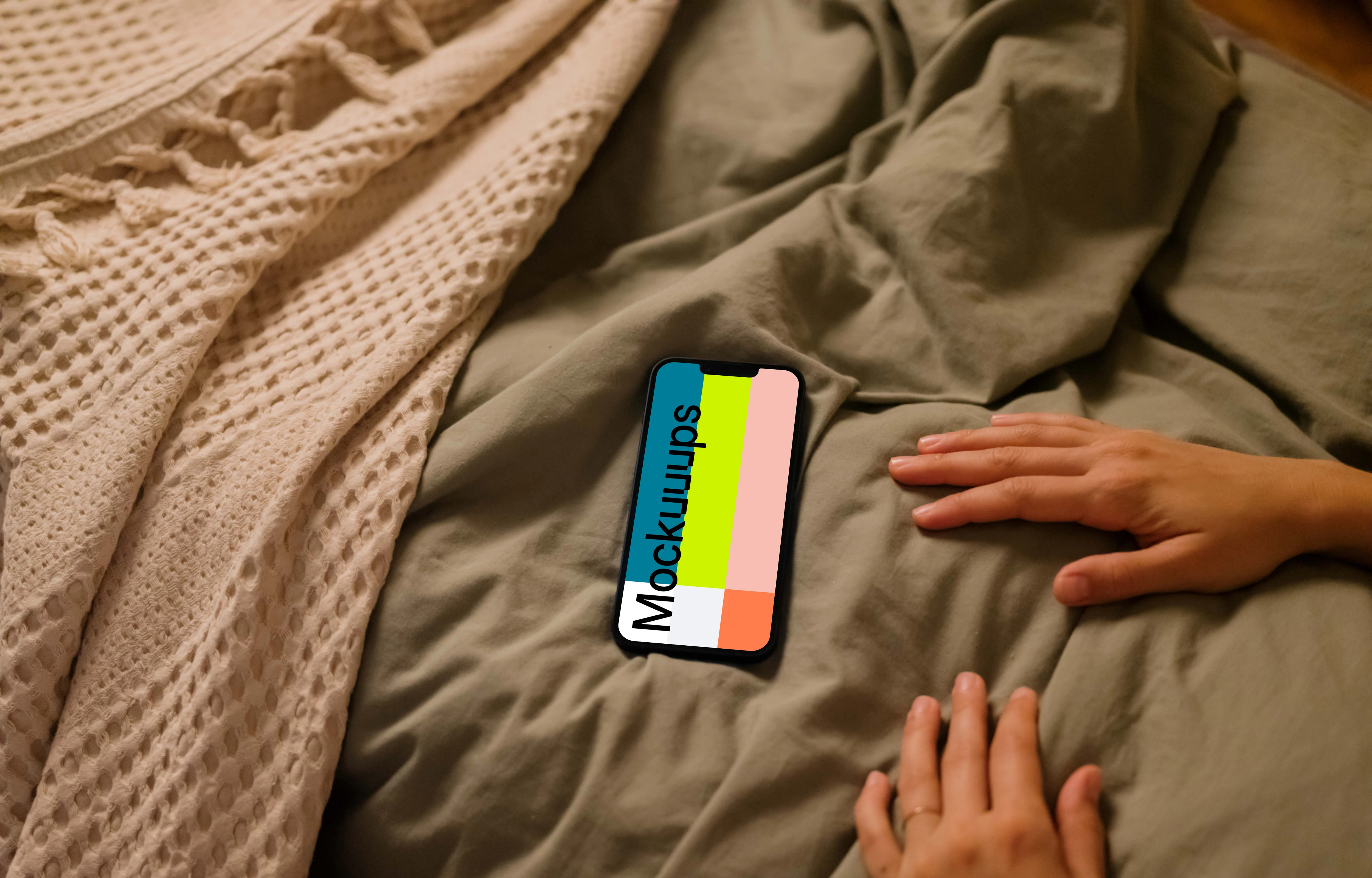 Female hands next to an iPhone 13 mockup