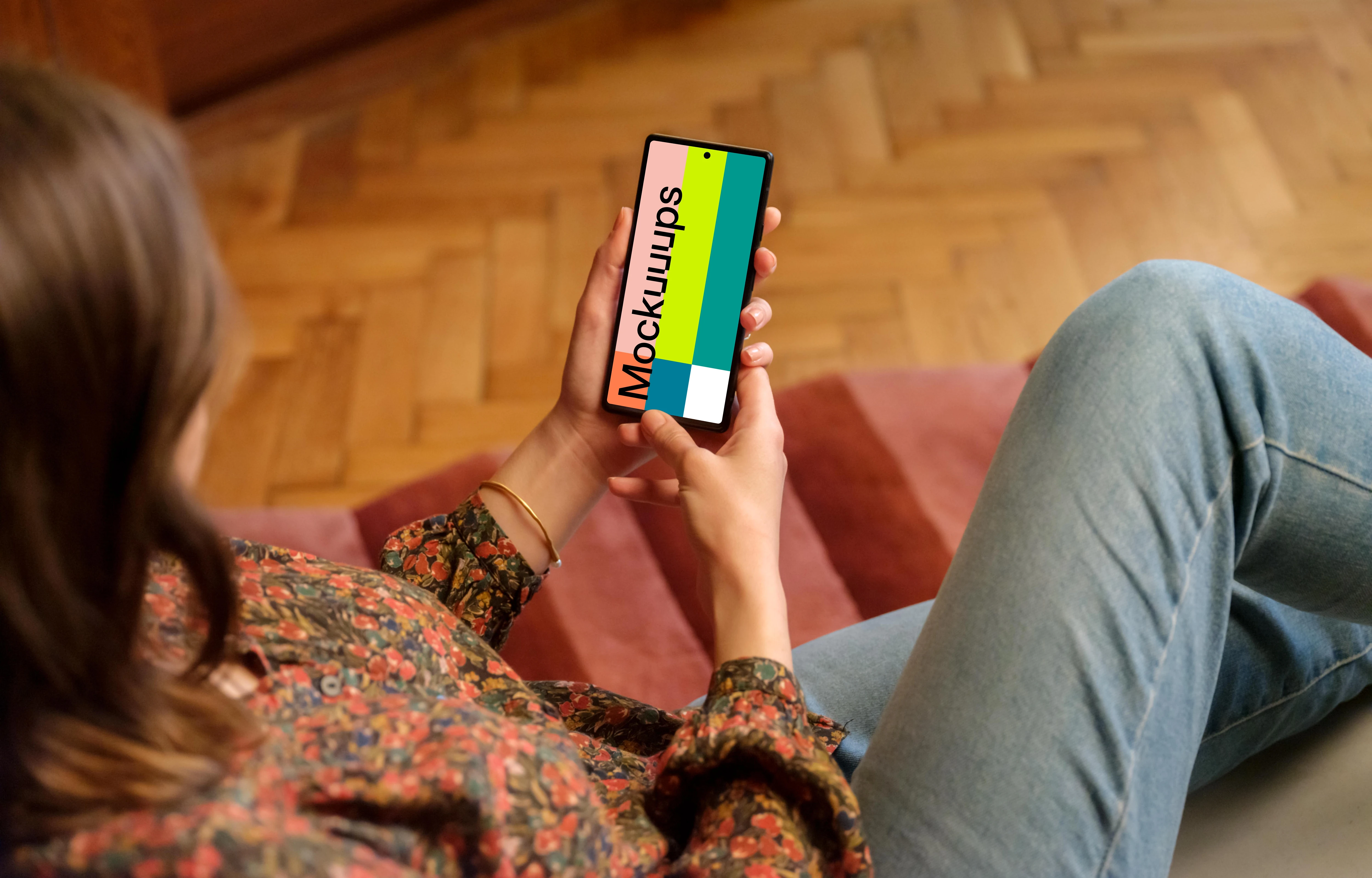 Female displaying Google Pixel mockup in wooden ambience of the lounge