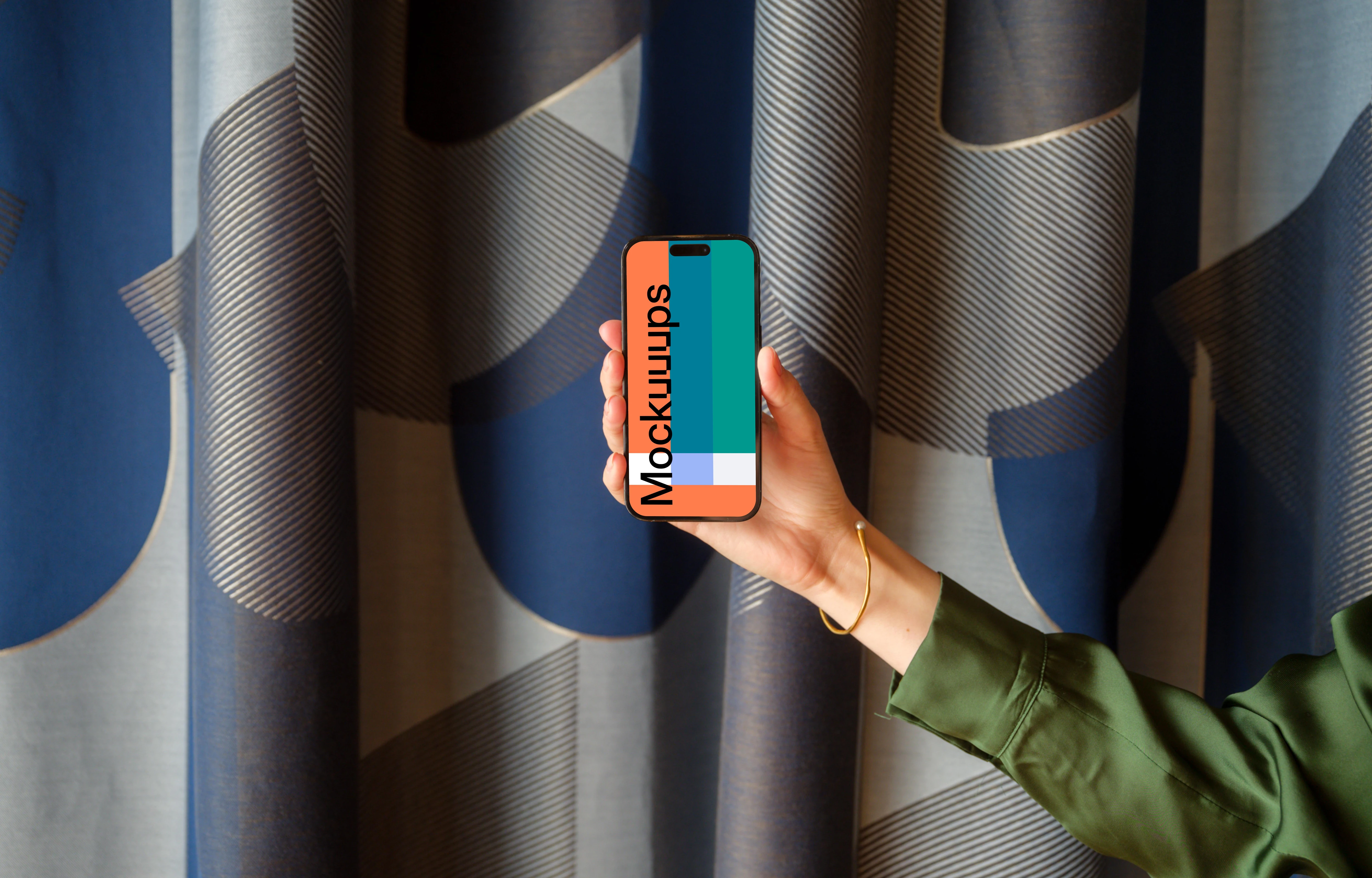 Female hand holding a phone in office