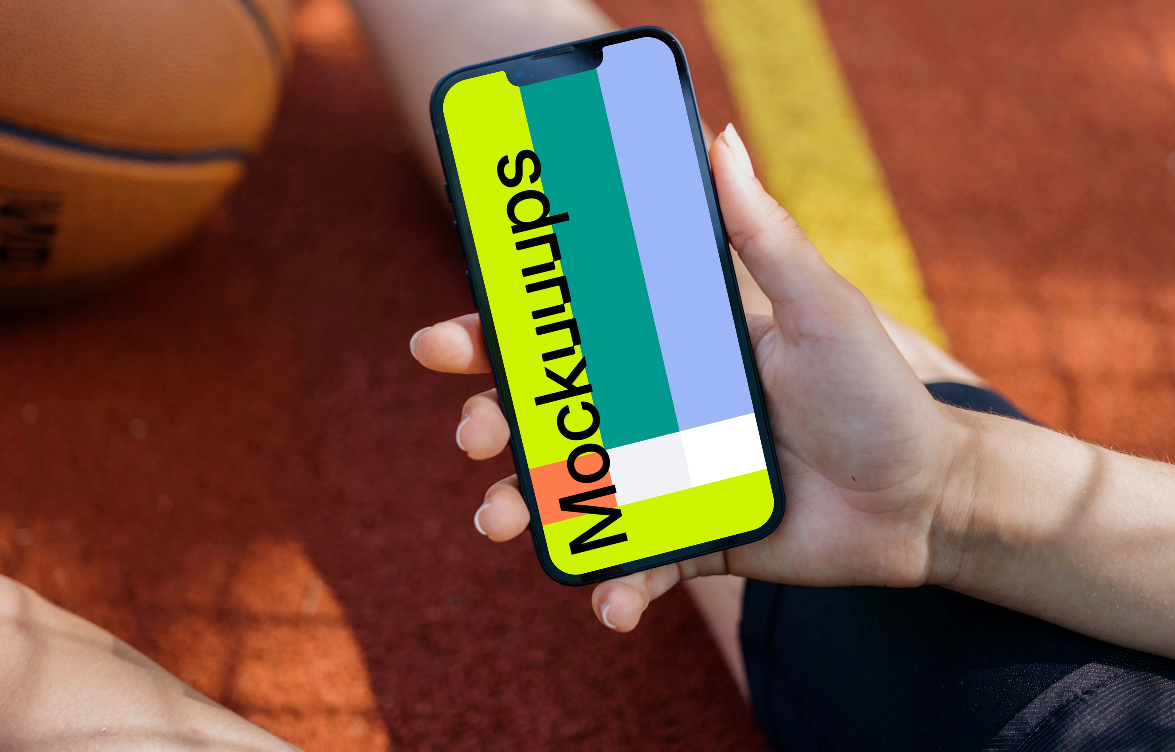 Female hand holding an iPhone 13 mockup