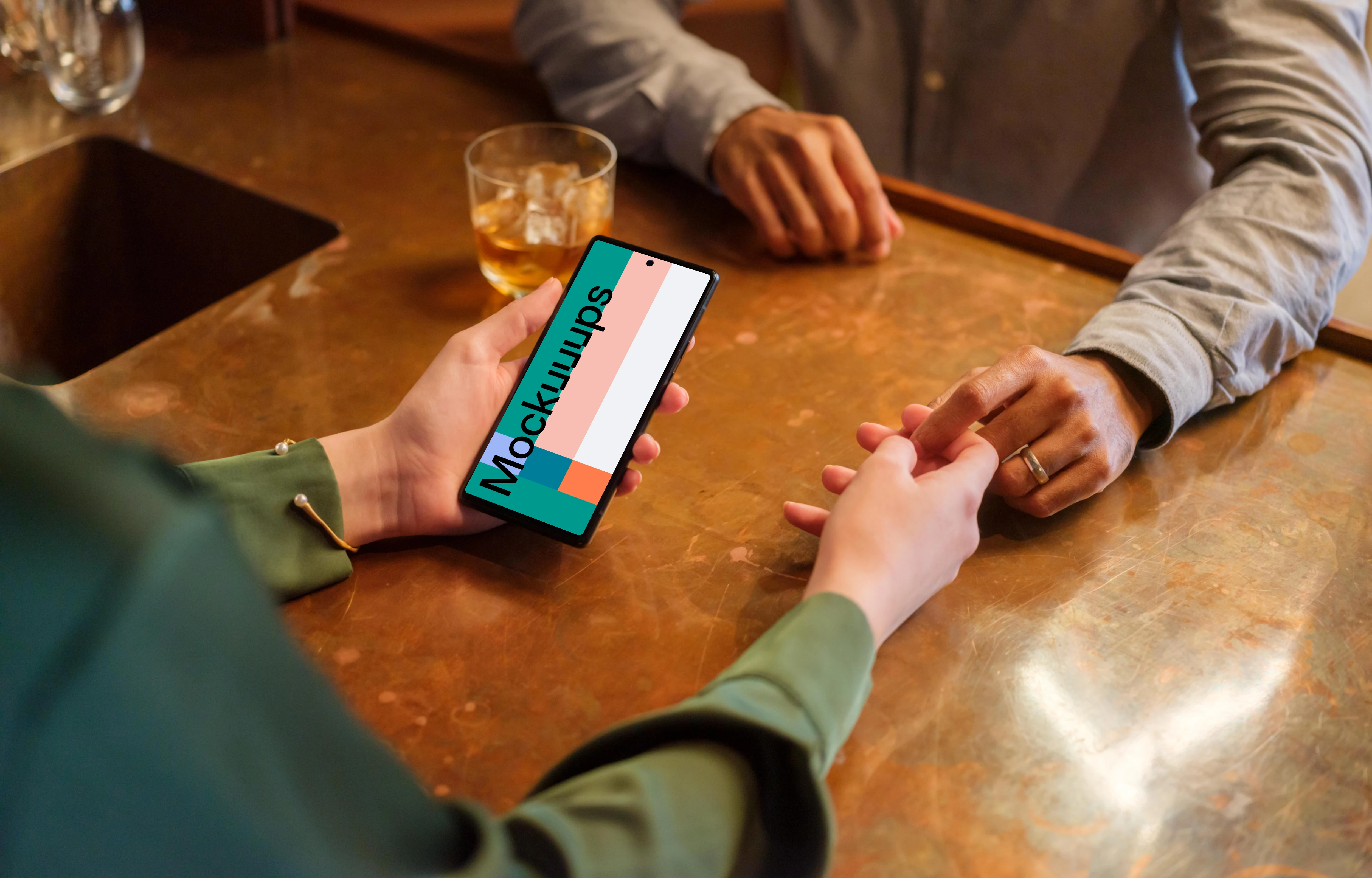 Female holding a Google Pixel 6 mockup in the lounge