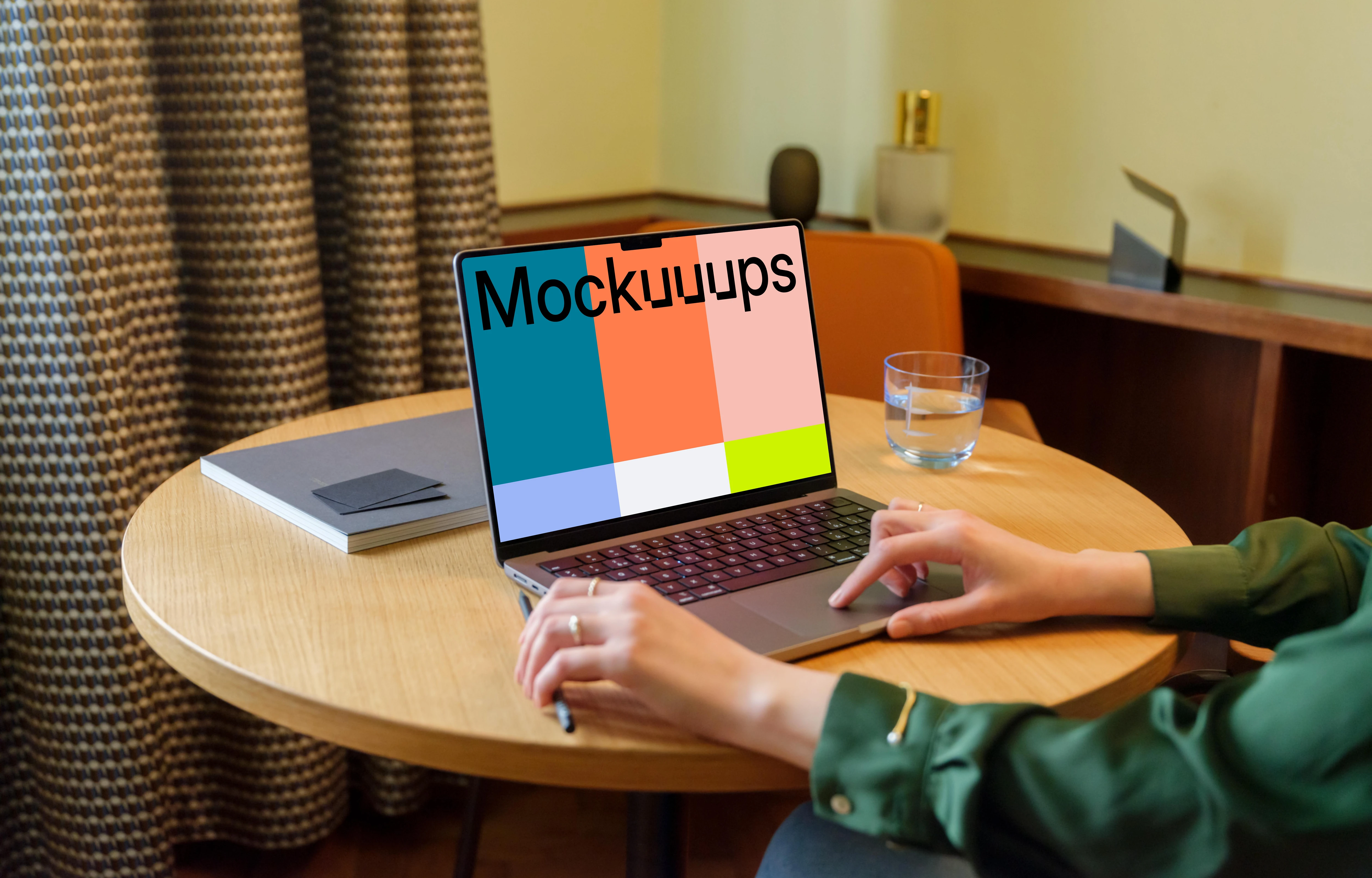Female in the office working on a MacBook mockup