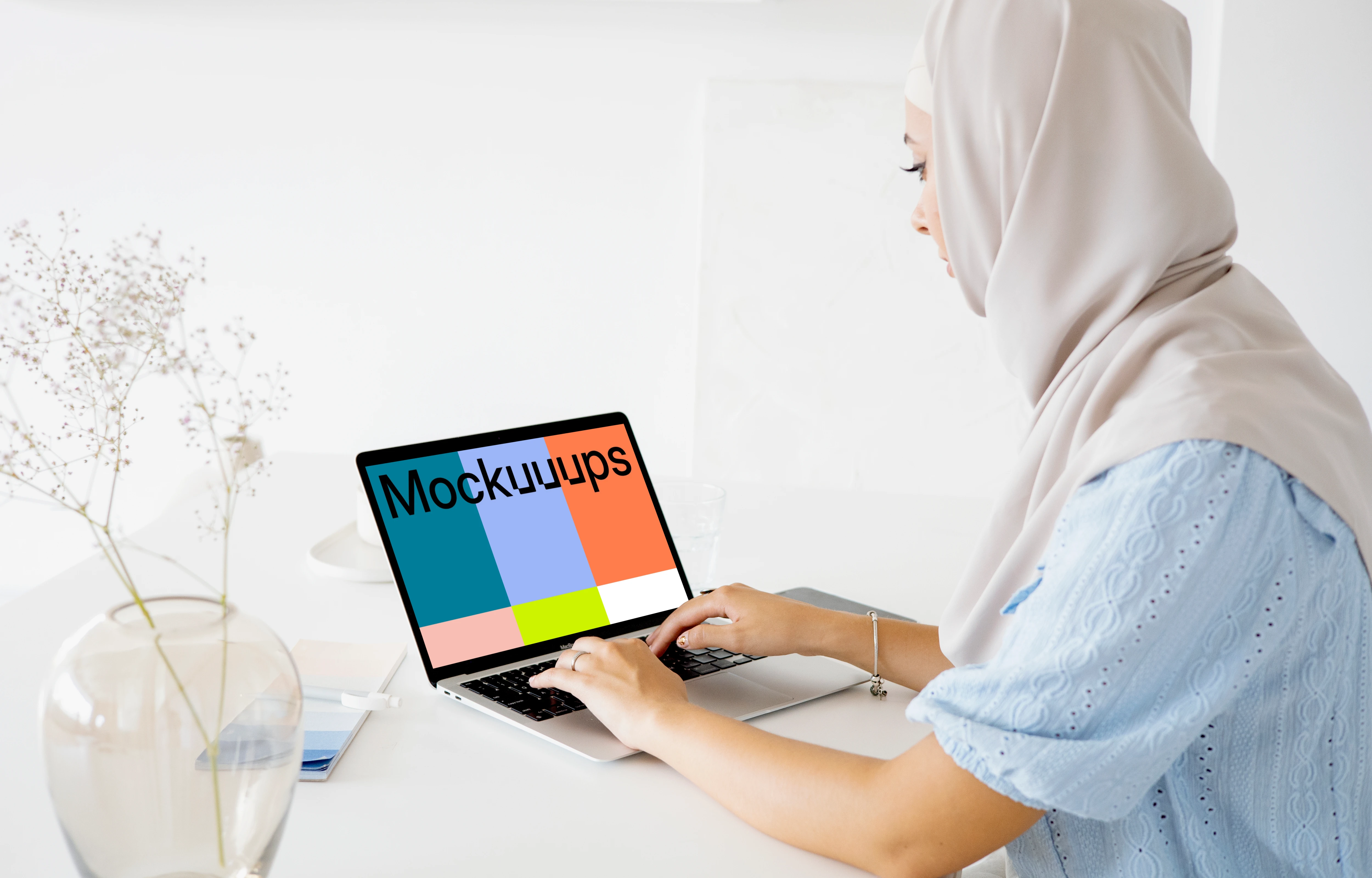 Female user typing on a Laptop mockup