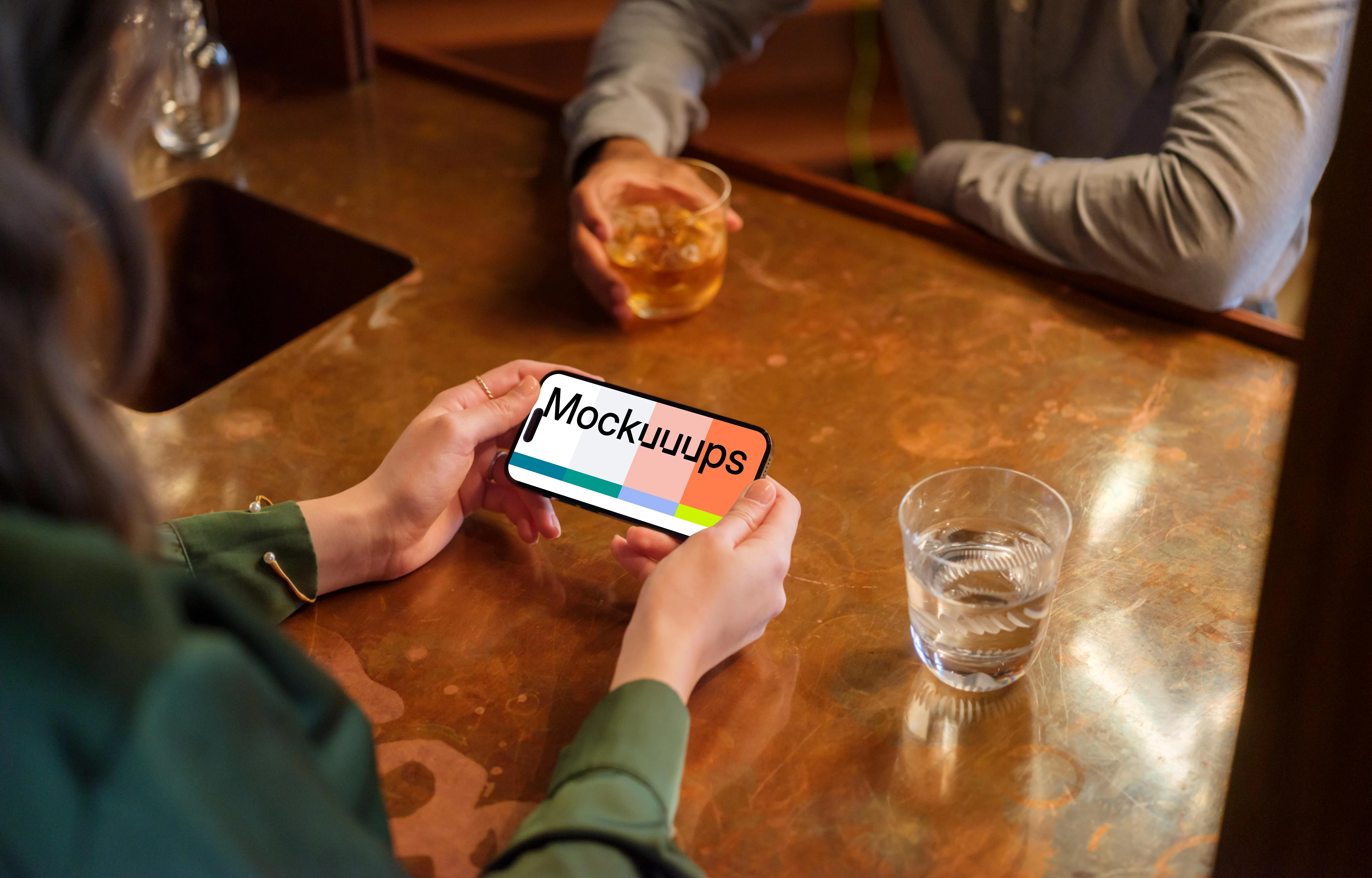 Female with iPhone mockup in her hands in the lounge setting