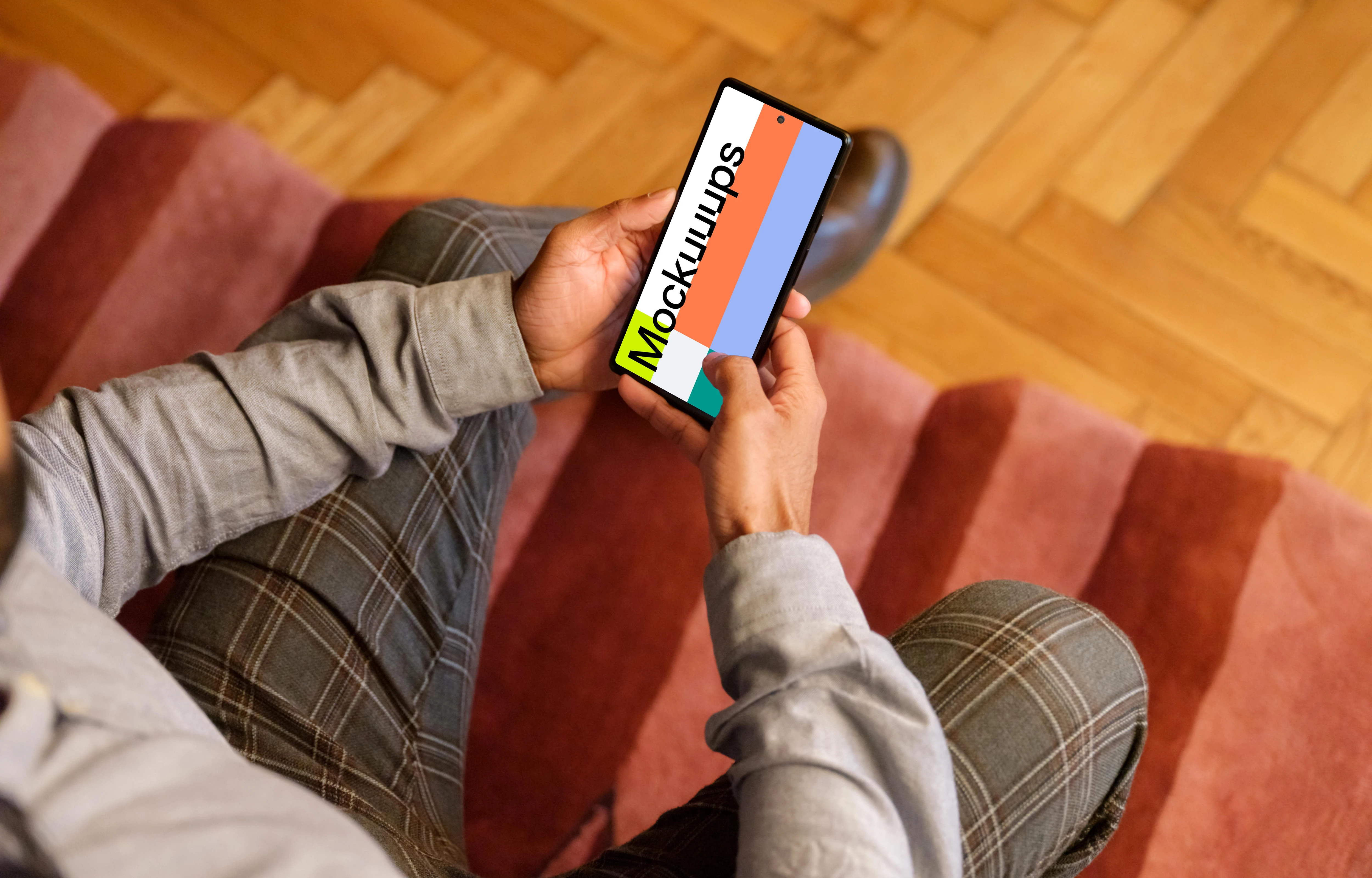 Office setting and man holding a Google Pixel mockup