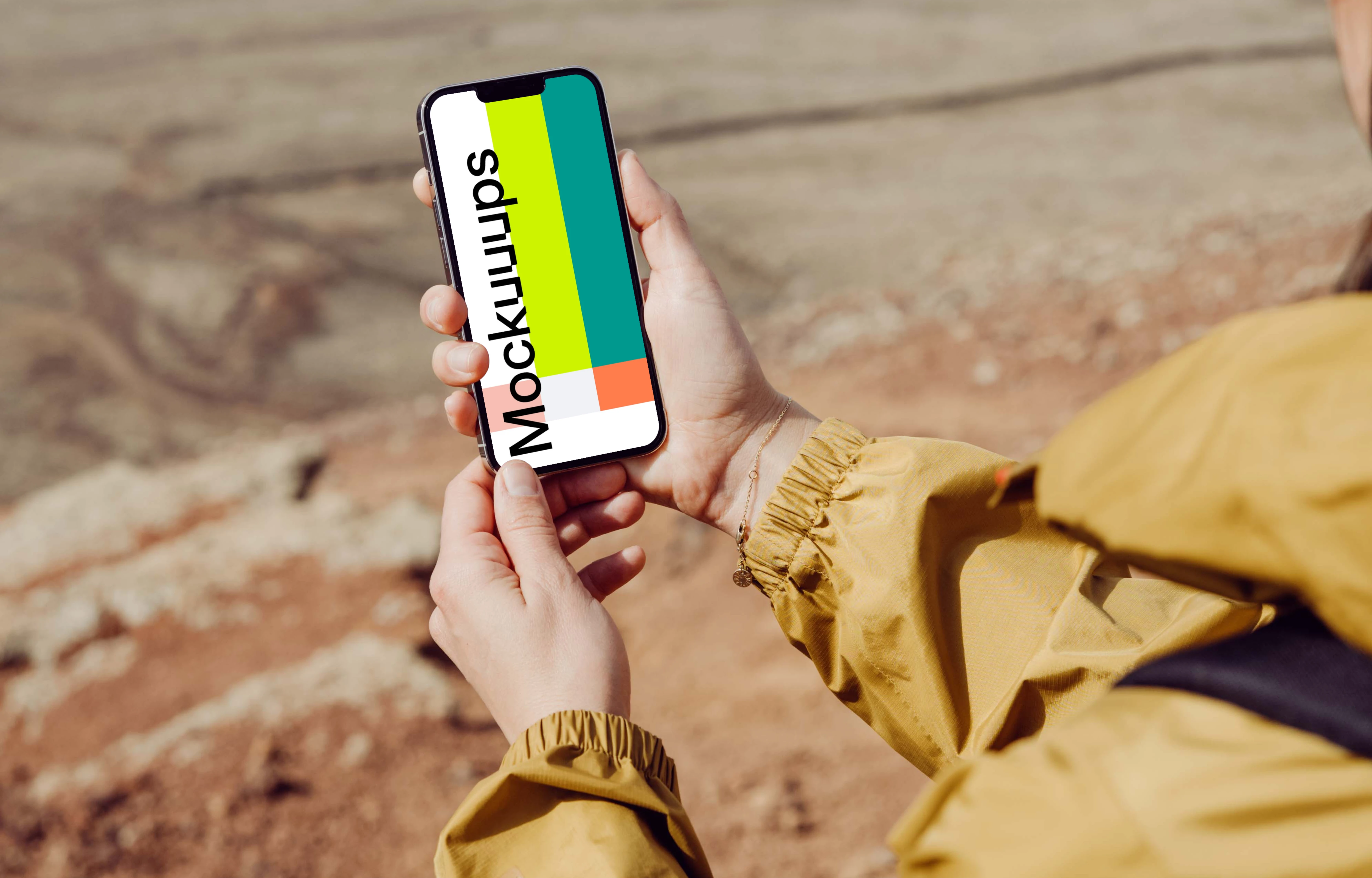 iPhone 13 Pro mockup held by a user on a sandy beach