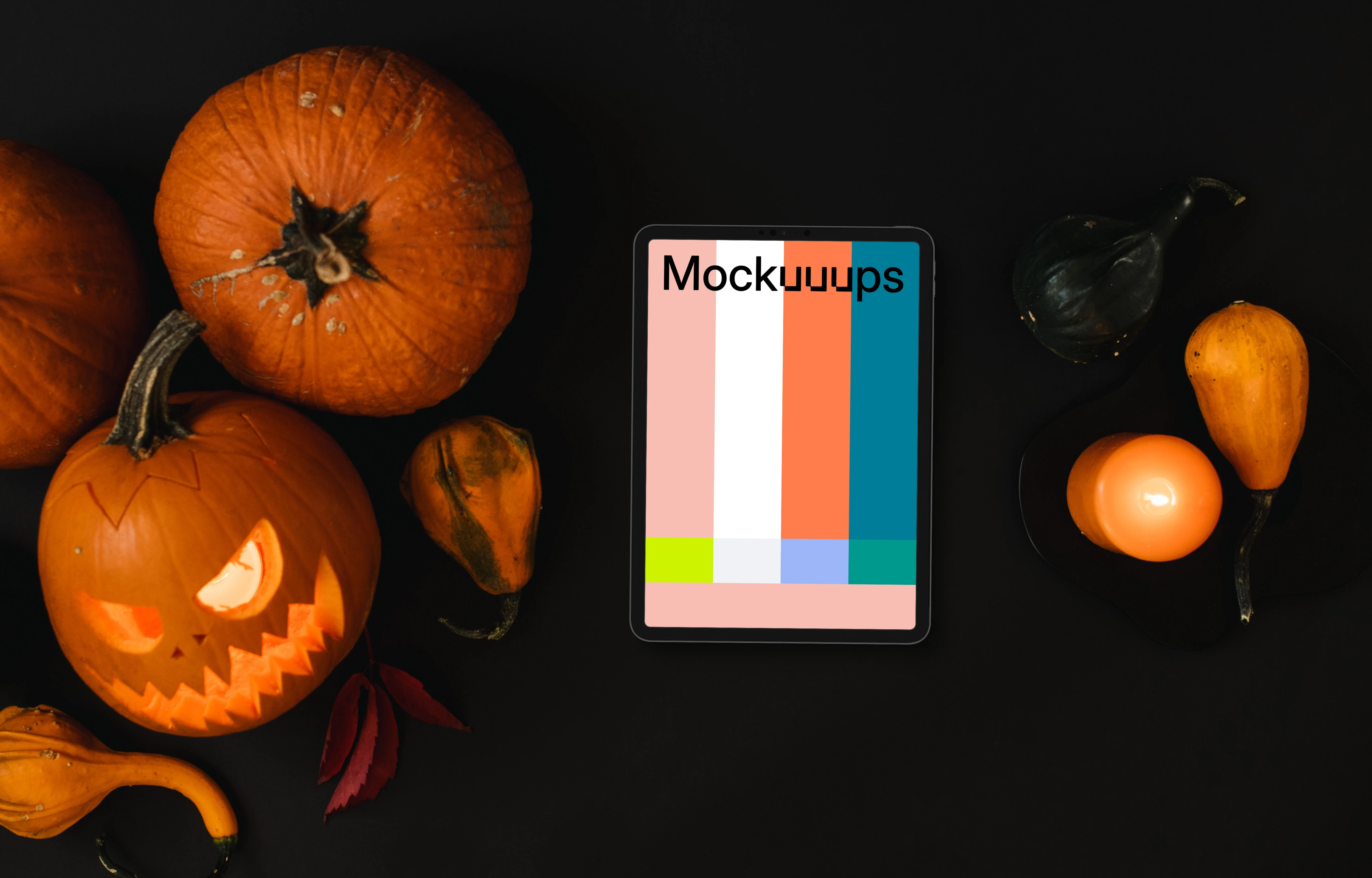 Halloween pumpkin mockup with a tablet and candles