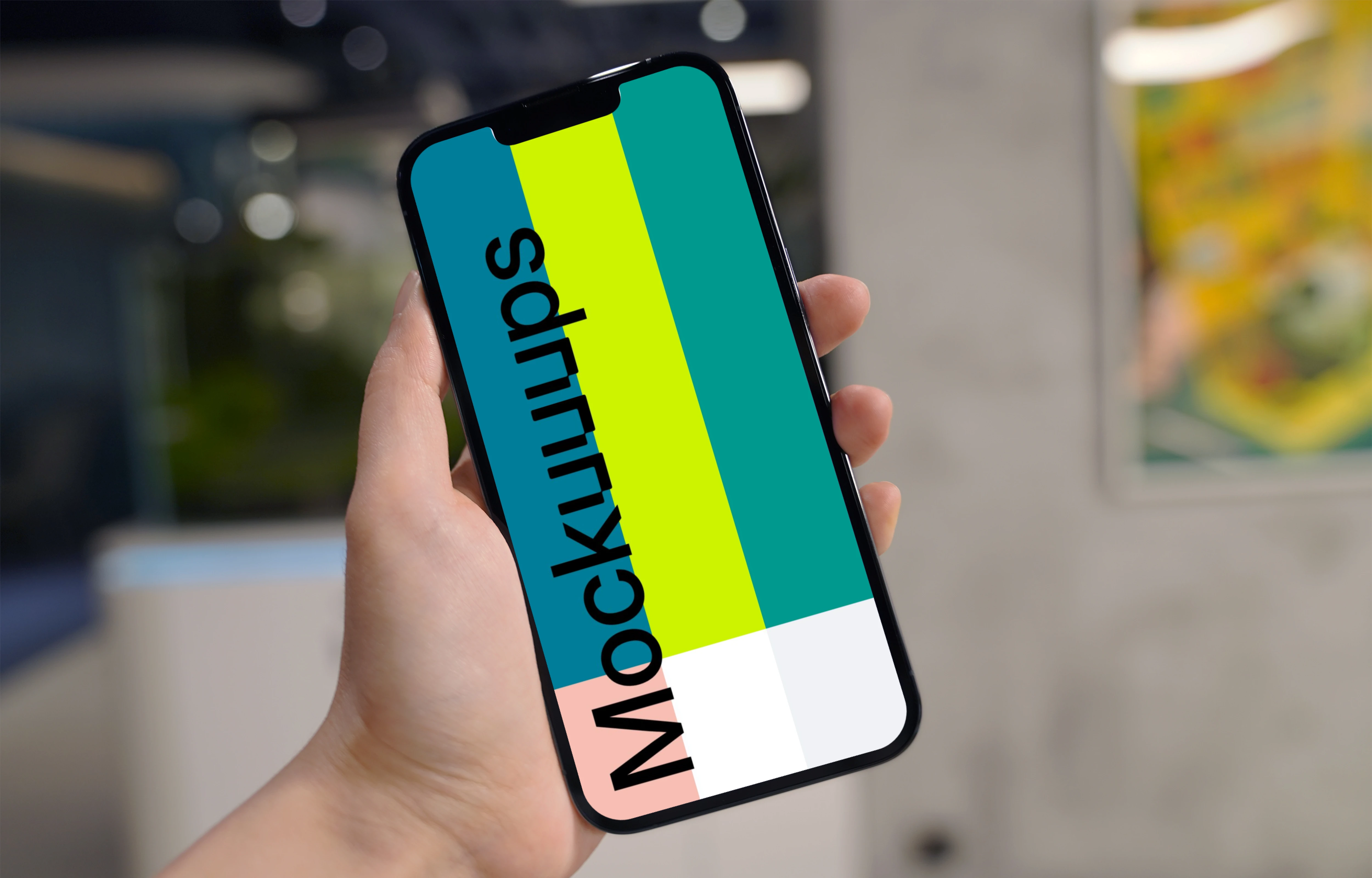 Hand holding an iPhone 13 Pro mockup