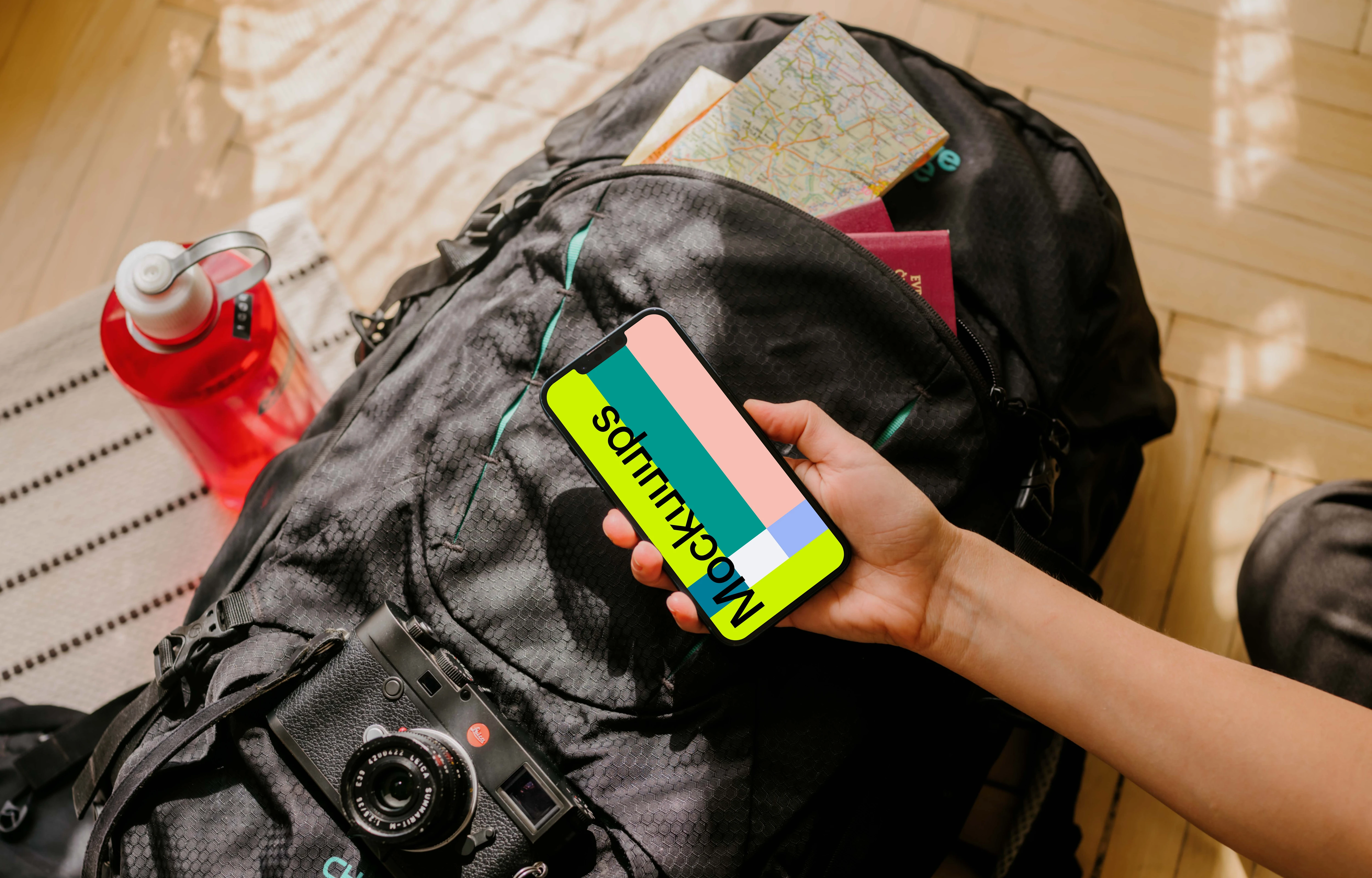 Hand holding an iPhone mockup