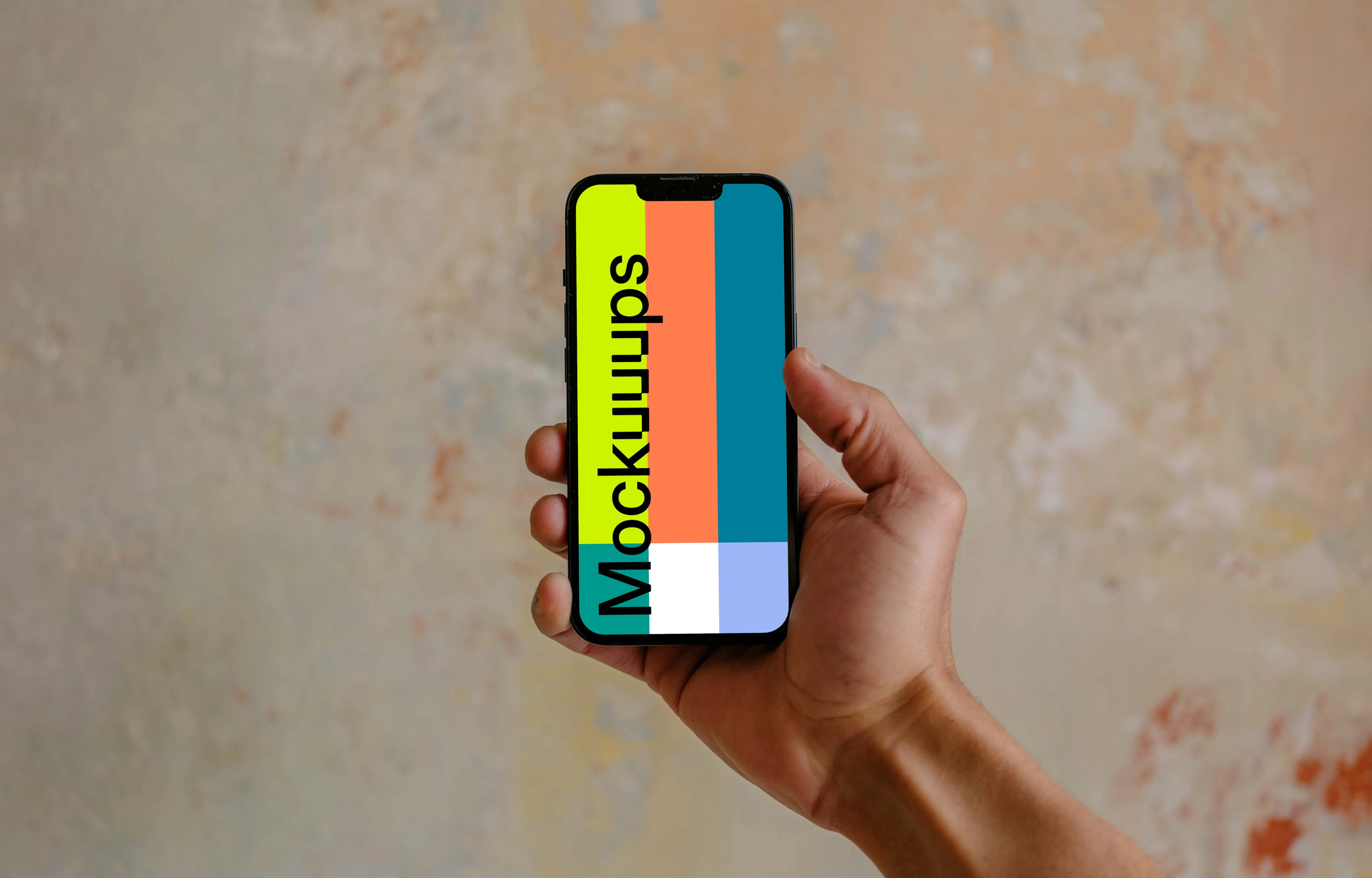 Hand holding iPhone 13 mockup