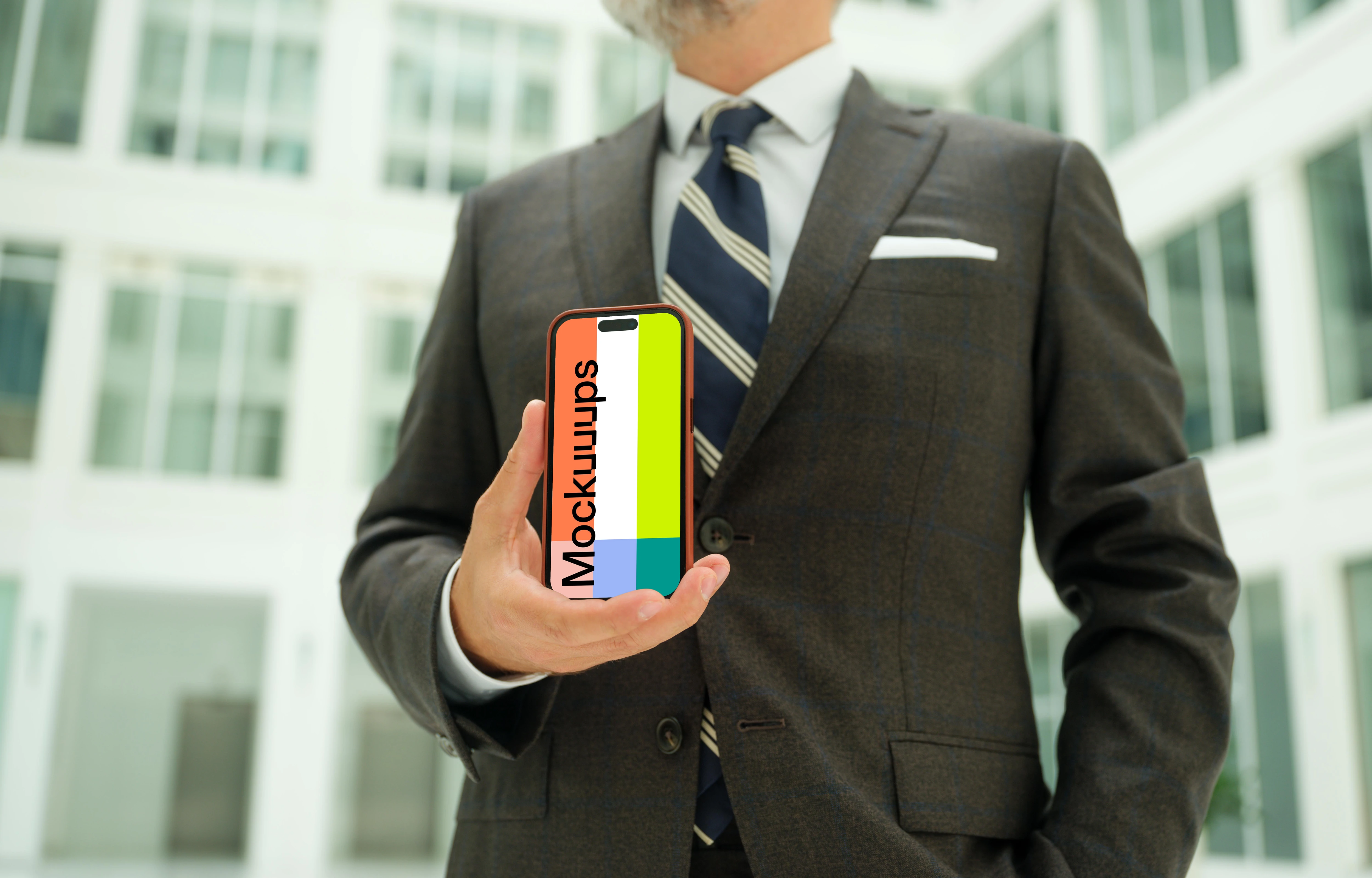 Businessman holding an iPhone mockup